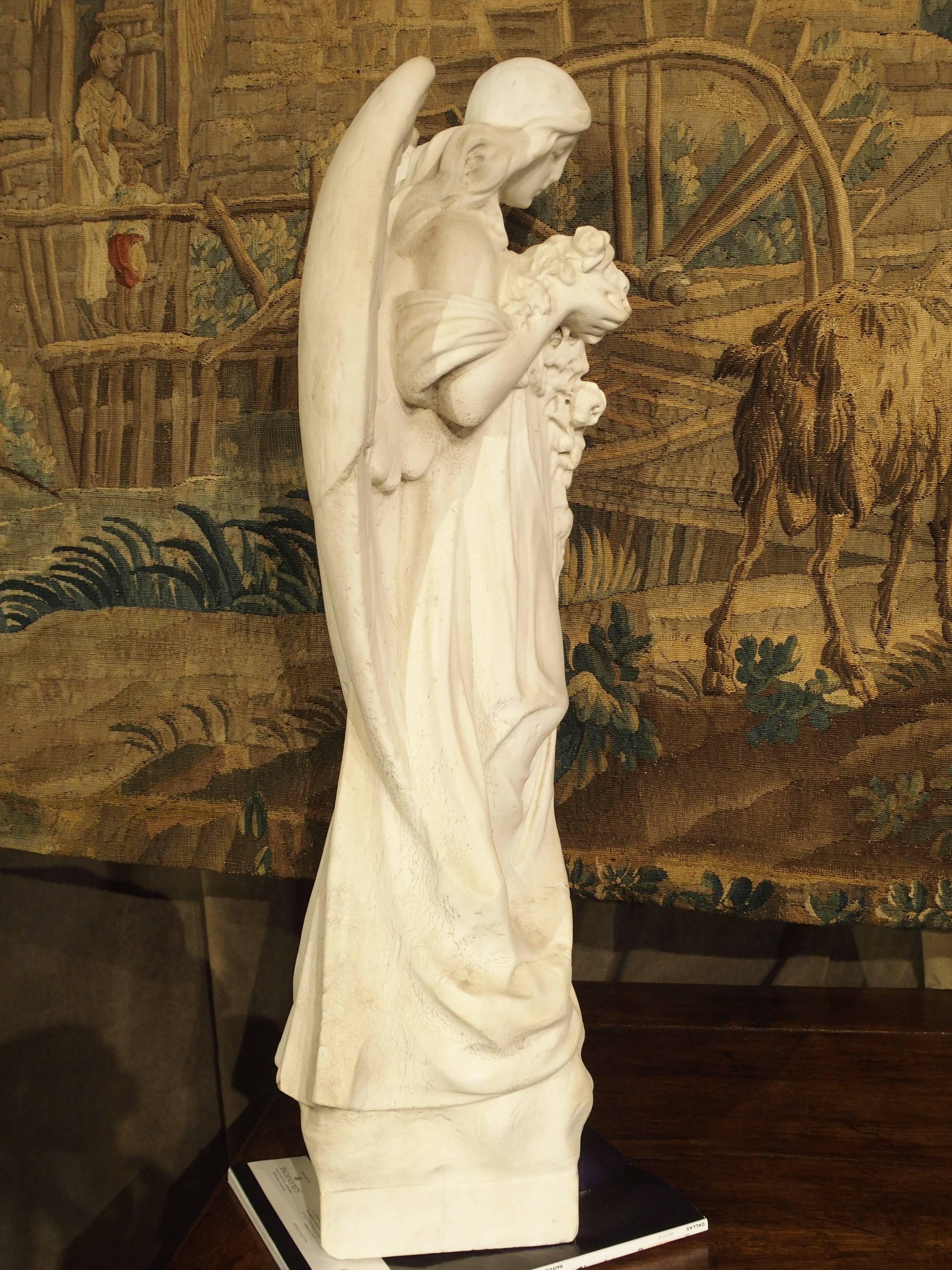 Unknown Carved Marble Statue of an Angel Holding a Bouquet