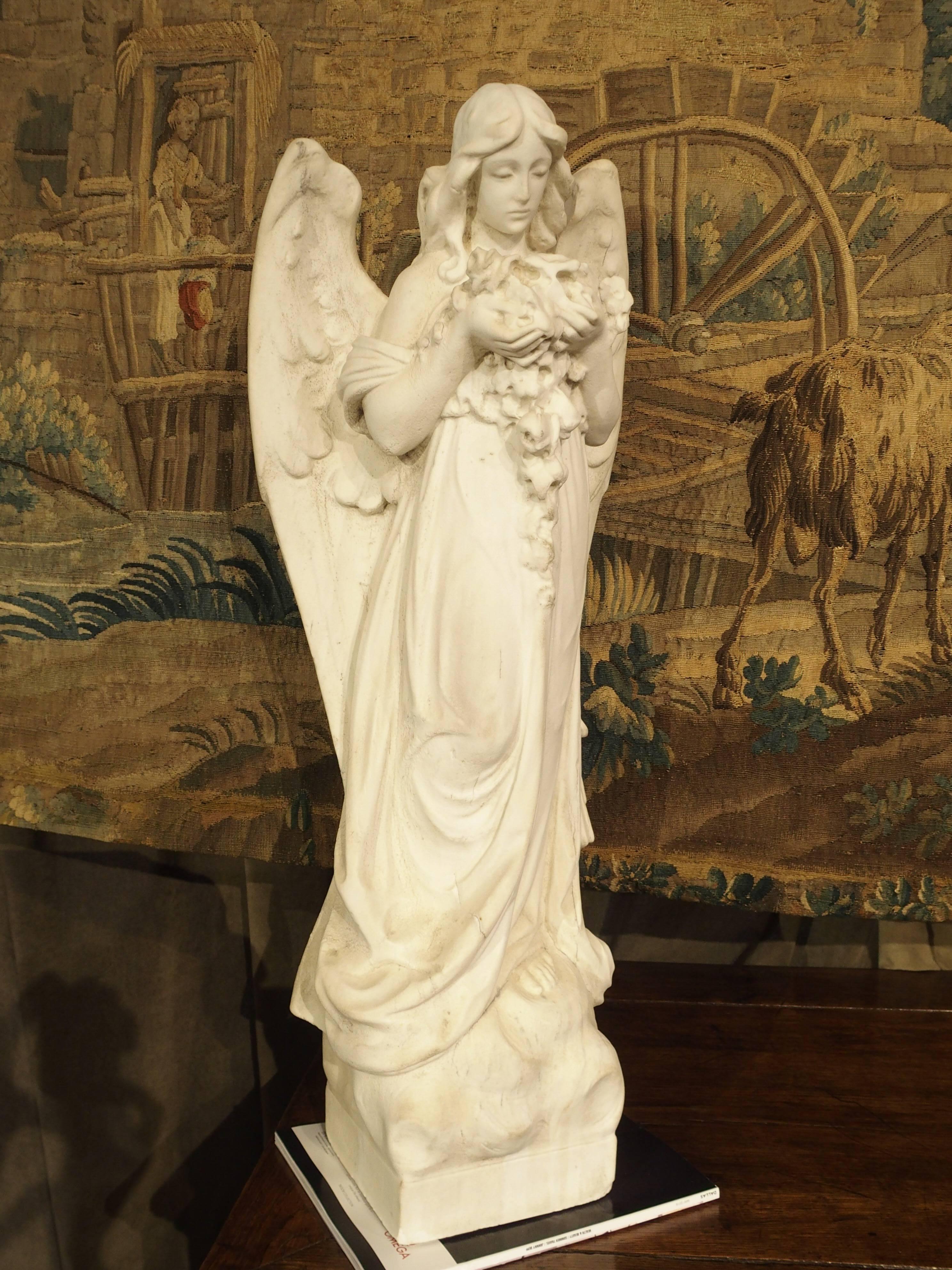 Carved Marble Statue of an Angel Holding a Bouquet In Good Condition In Dallas, TX