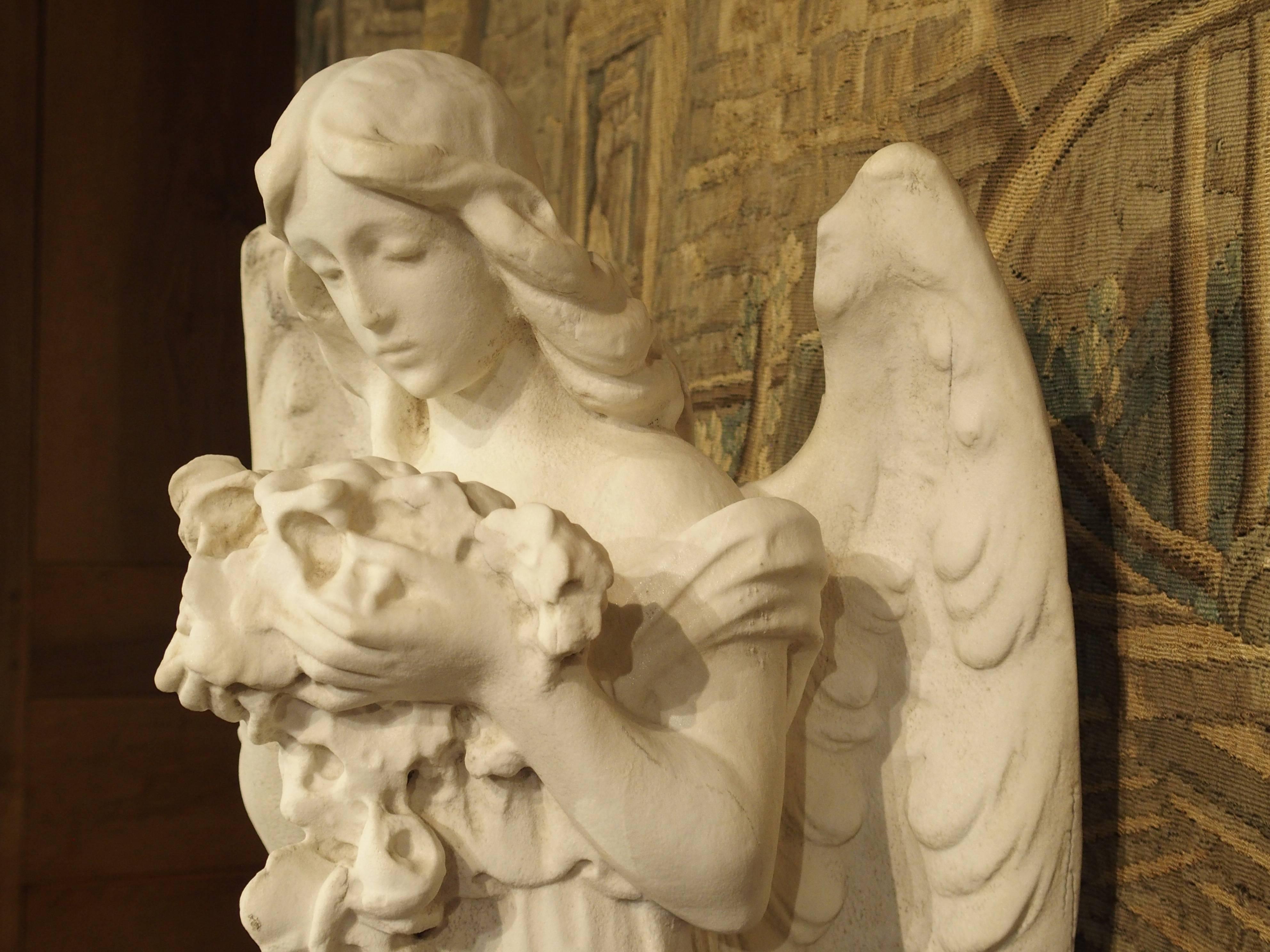 20th Century Carved Marble Statue of an Angel Holding a Bouquet