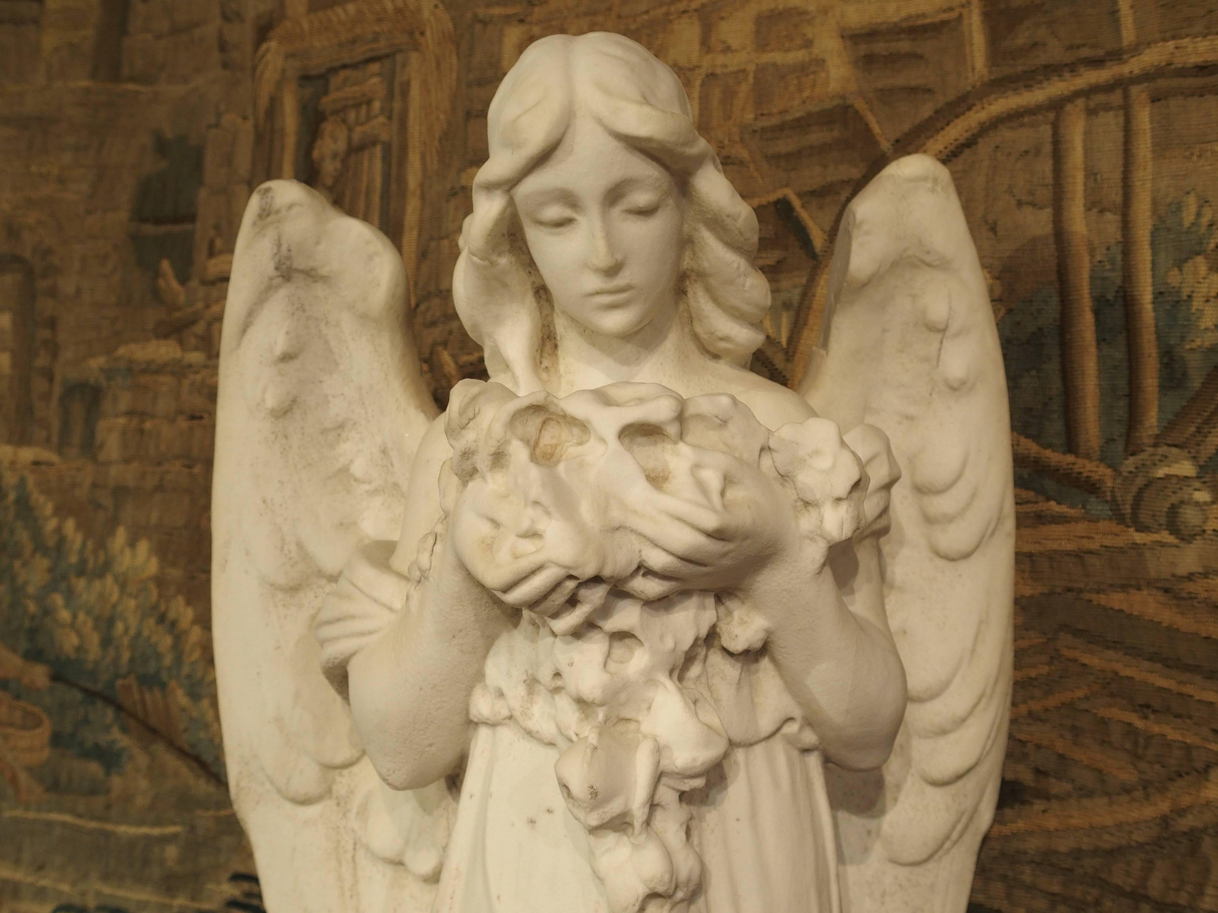 Carved Marble Statue of an Angel Holding a Bouquet 3