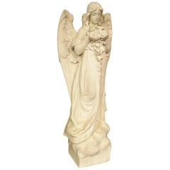 Carved Marble Statue of an Angel Holding a Bouquet