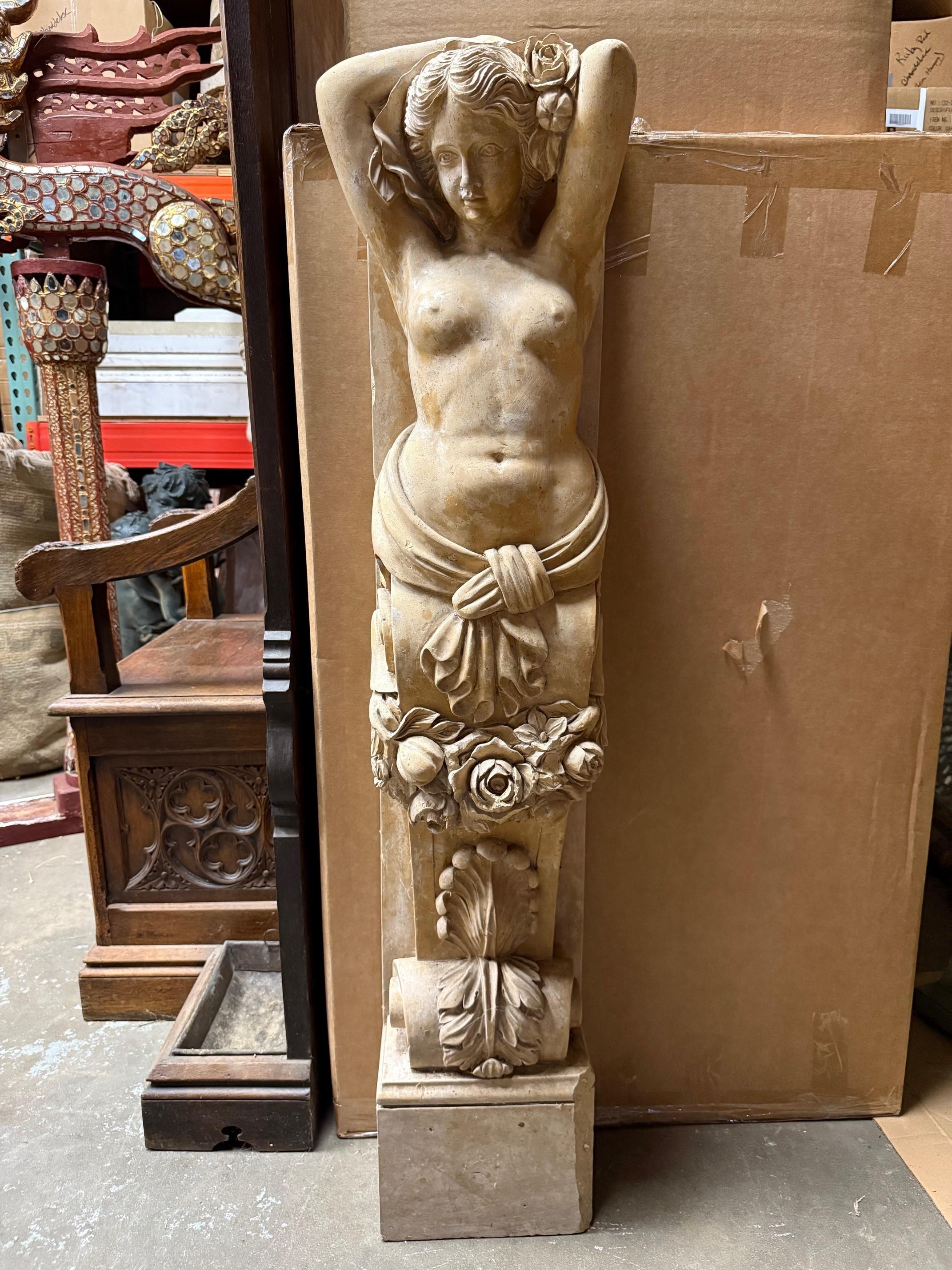 A carved marble nude female caryatid form on scrolled bracket with flowers. This is a nice piece probably originally from a fabulous mantel. Caryatids are female figures that are used as architectural supports in place of columns. Some of the