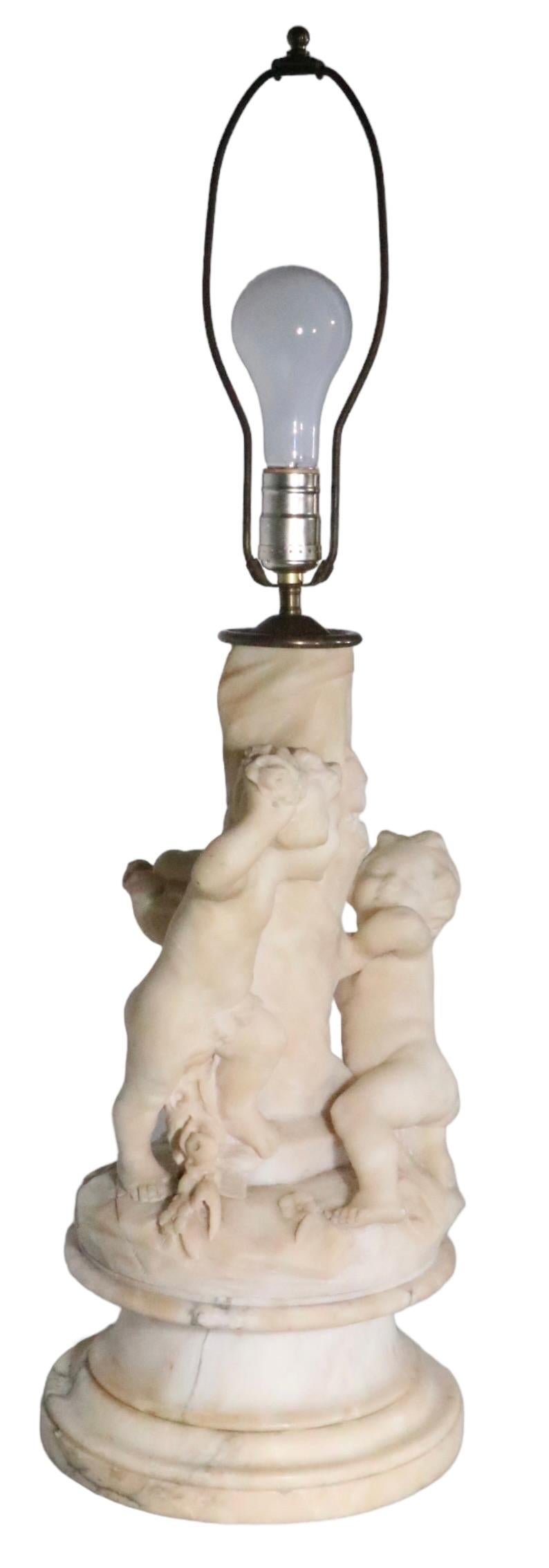 Classical Roman Carved Marble Table Lamp with Cupid Figures Made in Italy signed Corsi  For Sale