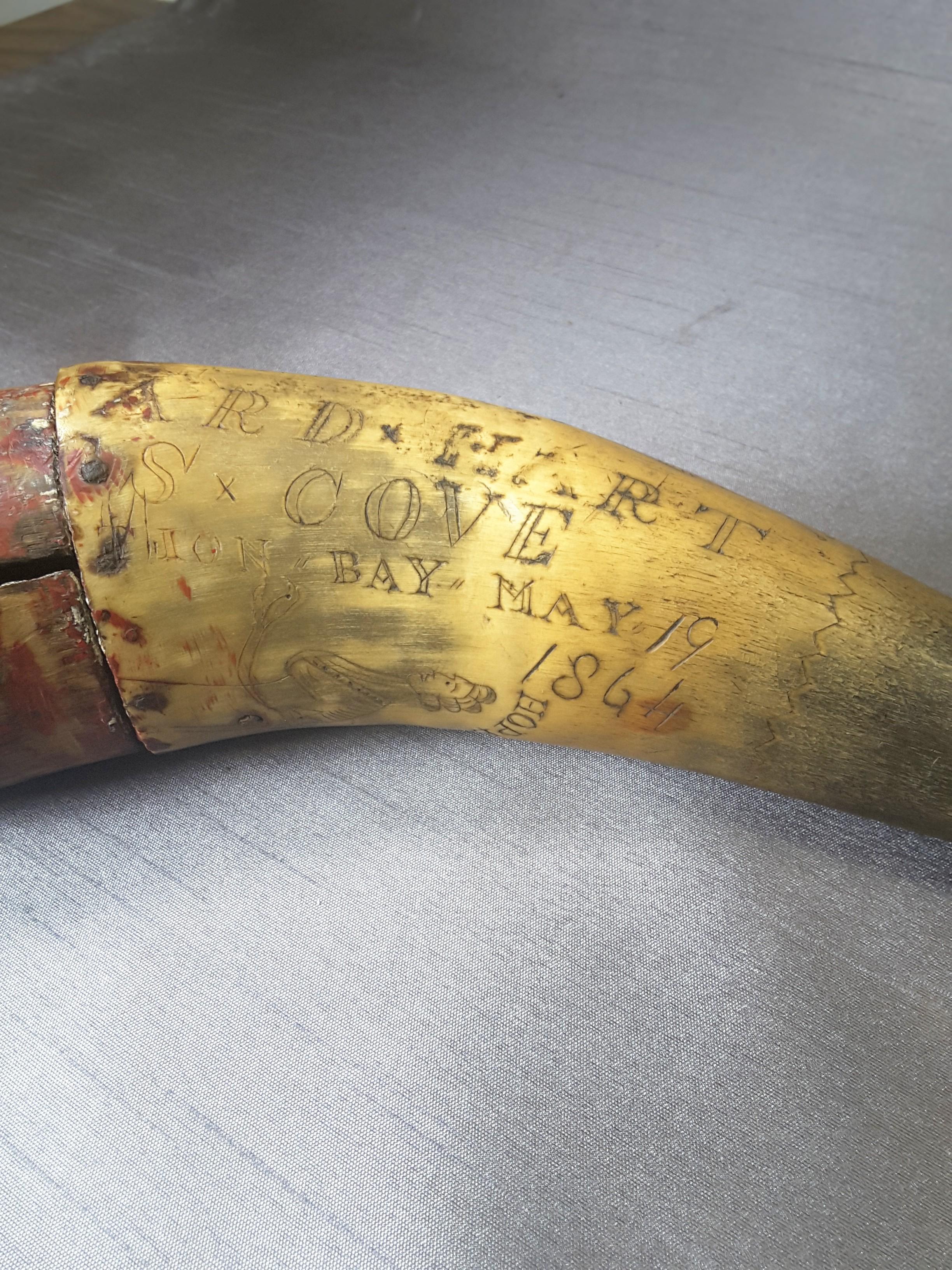 Carved marine powder horn mermaids, two seahorses, ships maidenhead, dated May 19, 1864. Marked Arden's Bay Cove, Neptune's Teem, Large Cross, Hope & Wood Cap. The powder horn is in untouched condition, as found condition. The powder horn measures