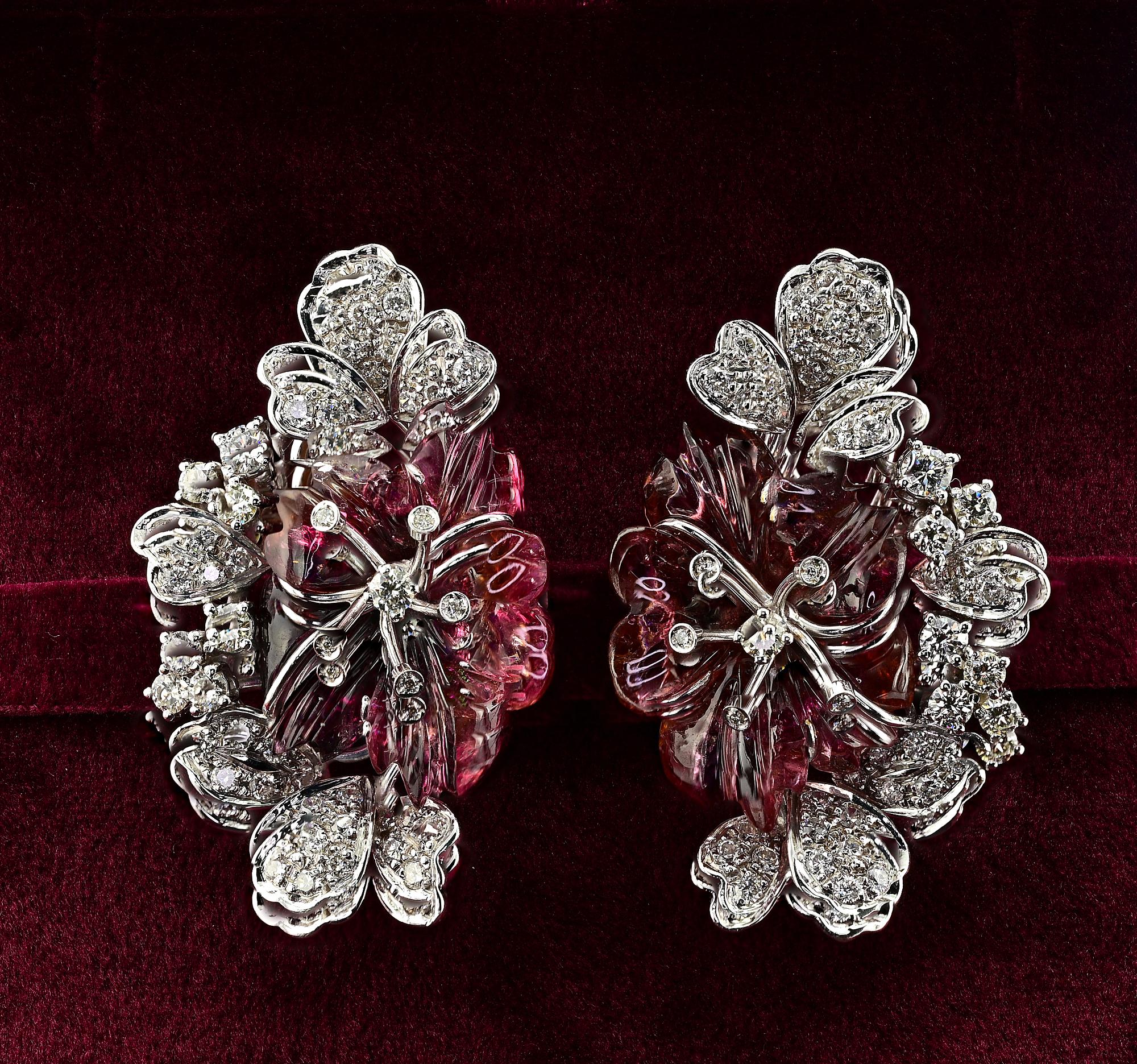 This magnificent pair of vintage earrings are 1960 circa
Skillfully Hand crafted of solid 18 KT white gold in awesome flowers and leaf design
They take inspiration by the beautiful hand carved natural Tourmaline of gorgeous water melon