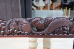 Carved Mirror Depicting Three Squirrels