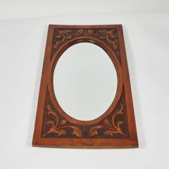 Carved Mirror with Oval Beveled Glass