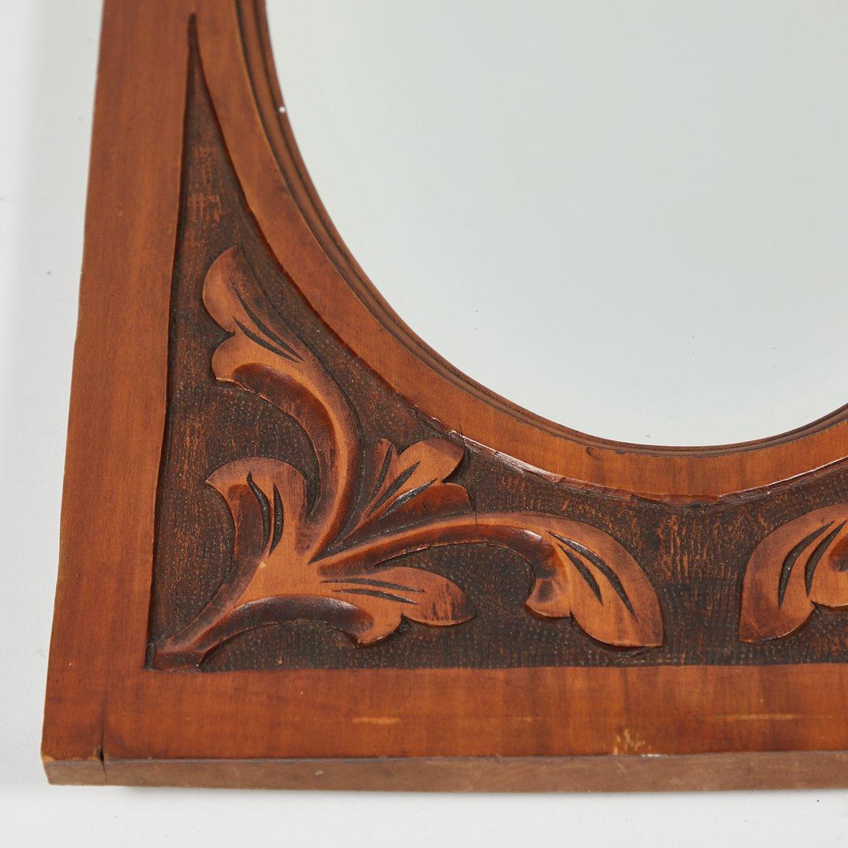 English Carved Mirror with Oval Beveled Glass For Sale