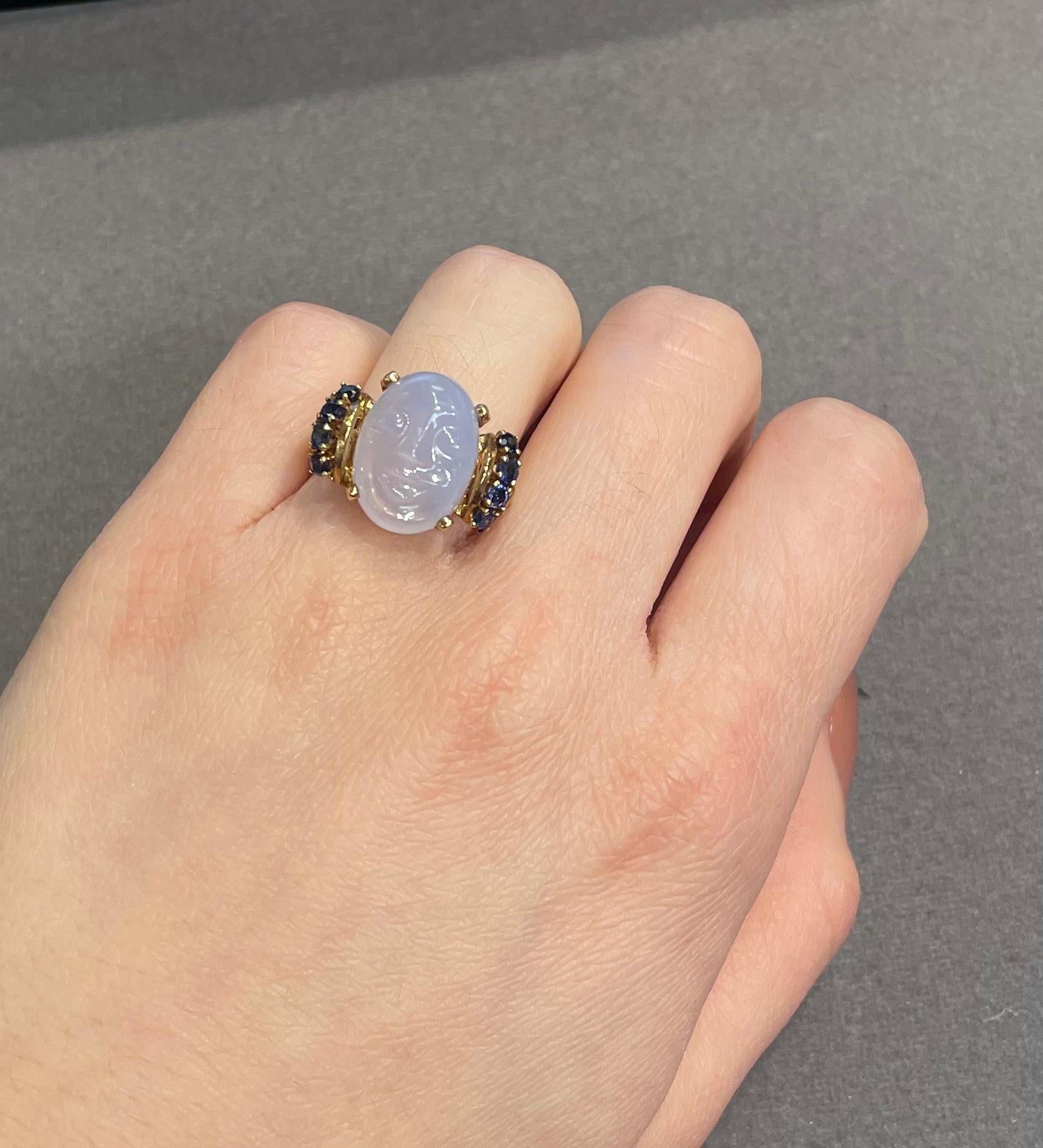 Carved Moonstone Ring 

A yellow gold ring set with a carved moonstone face accented with 8 sapphires

Approximate Sapphire Weight: .64 carats
Ring Size: 6.25
Complimentary resizing 
Metal Type: 14 karat gold