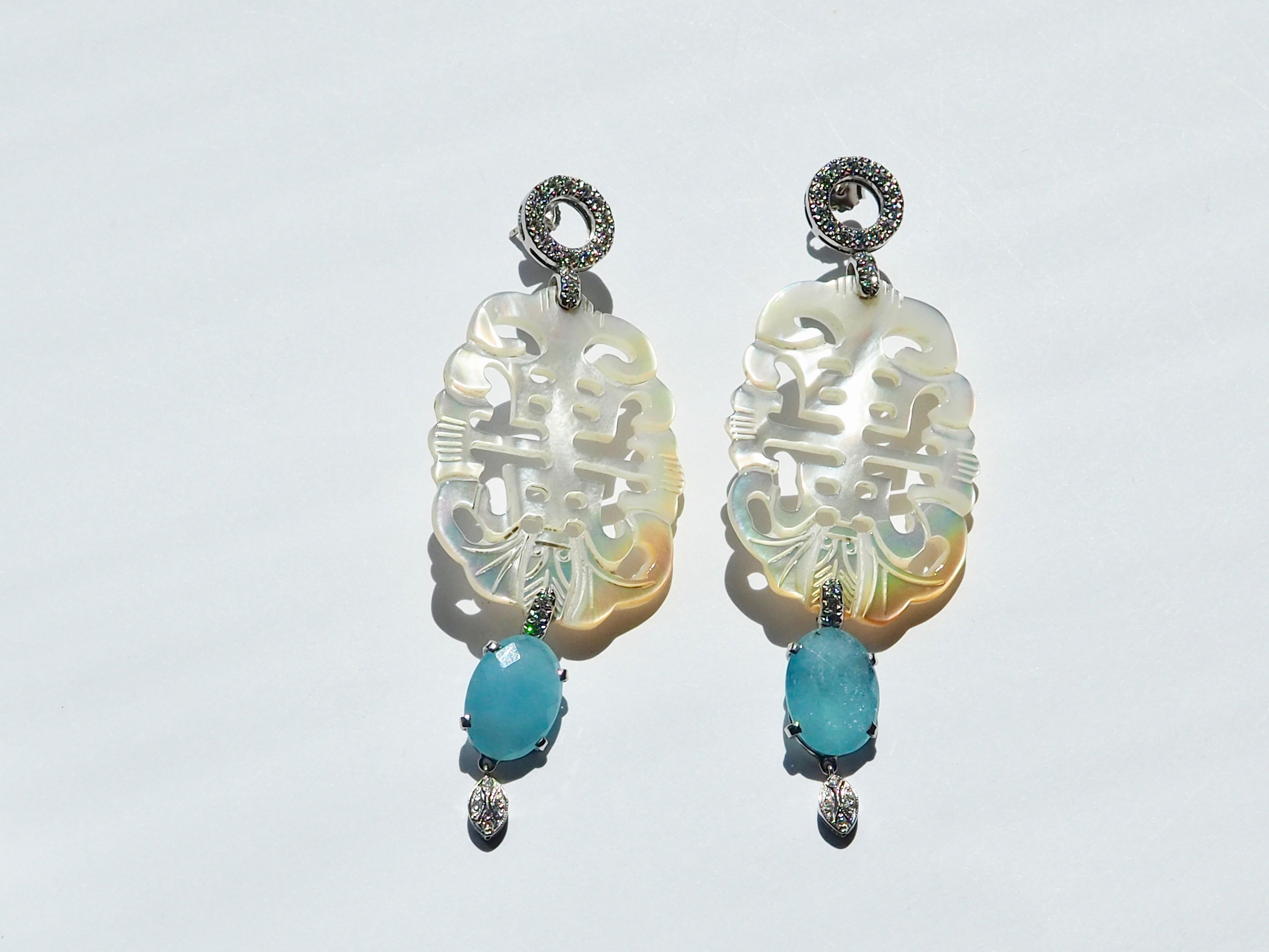 Long earrings with carved mother of pearls, diamonds ct 3, faced  sky blu calcedonio 18kt white gold 21gr. Total length  7,5 cm weight 8,70gr.
All Giulia Colussi jewelry is new and has never been previously owned or worn. Each item will arrive at