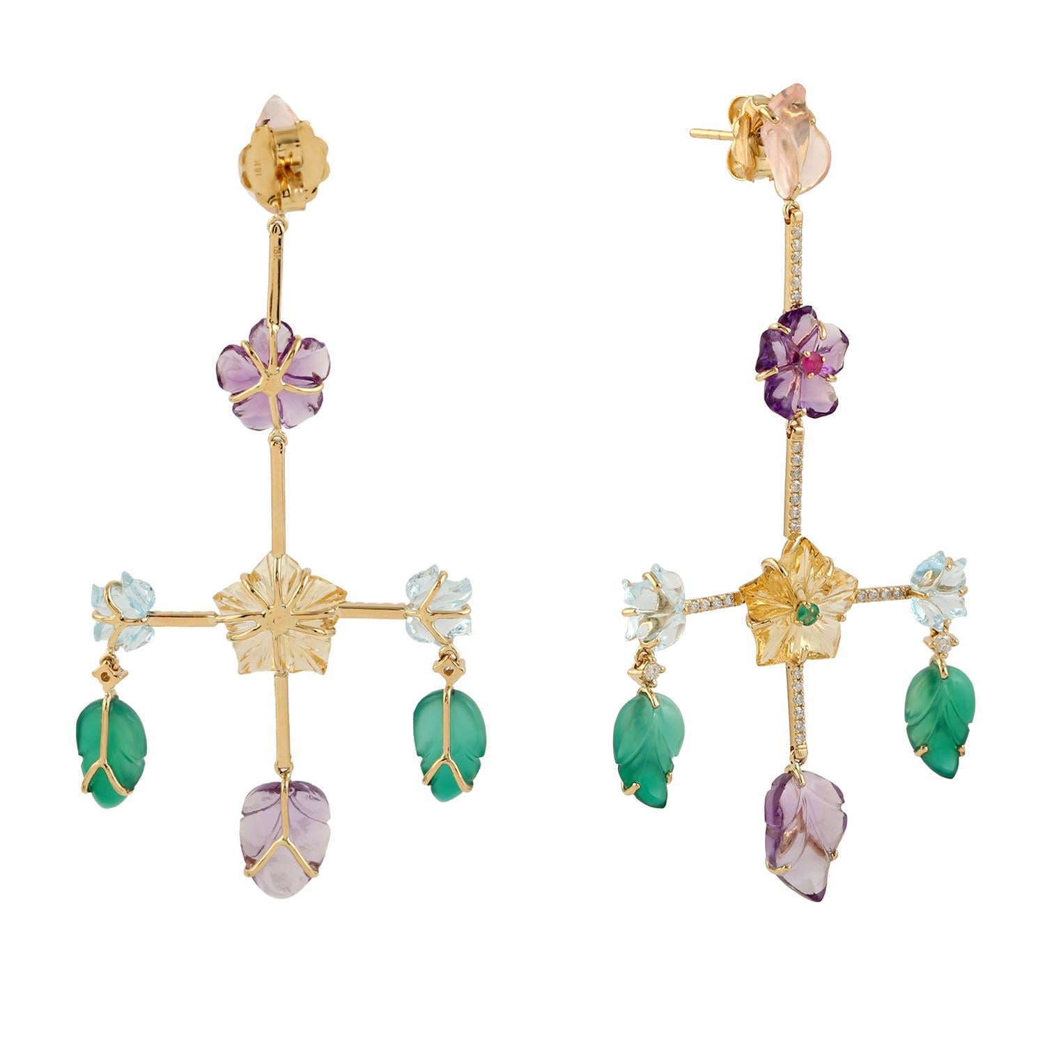 Cast in 14-karat gold. These beautiful earrings are set with 37.0 carats of carved multi gemstone, emerald, topaz, amethyst, citrine, ruby and .47 carats of sparkling diamonds.  See other flower collection matching pieces.

FOLLOW  MEGHNA JEWELS