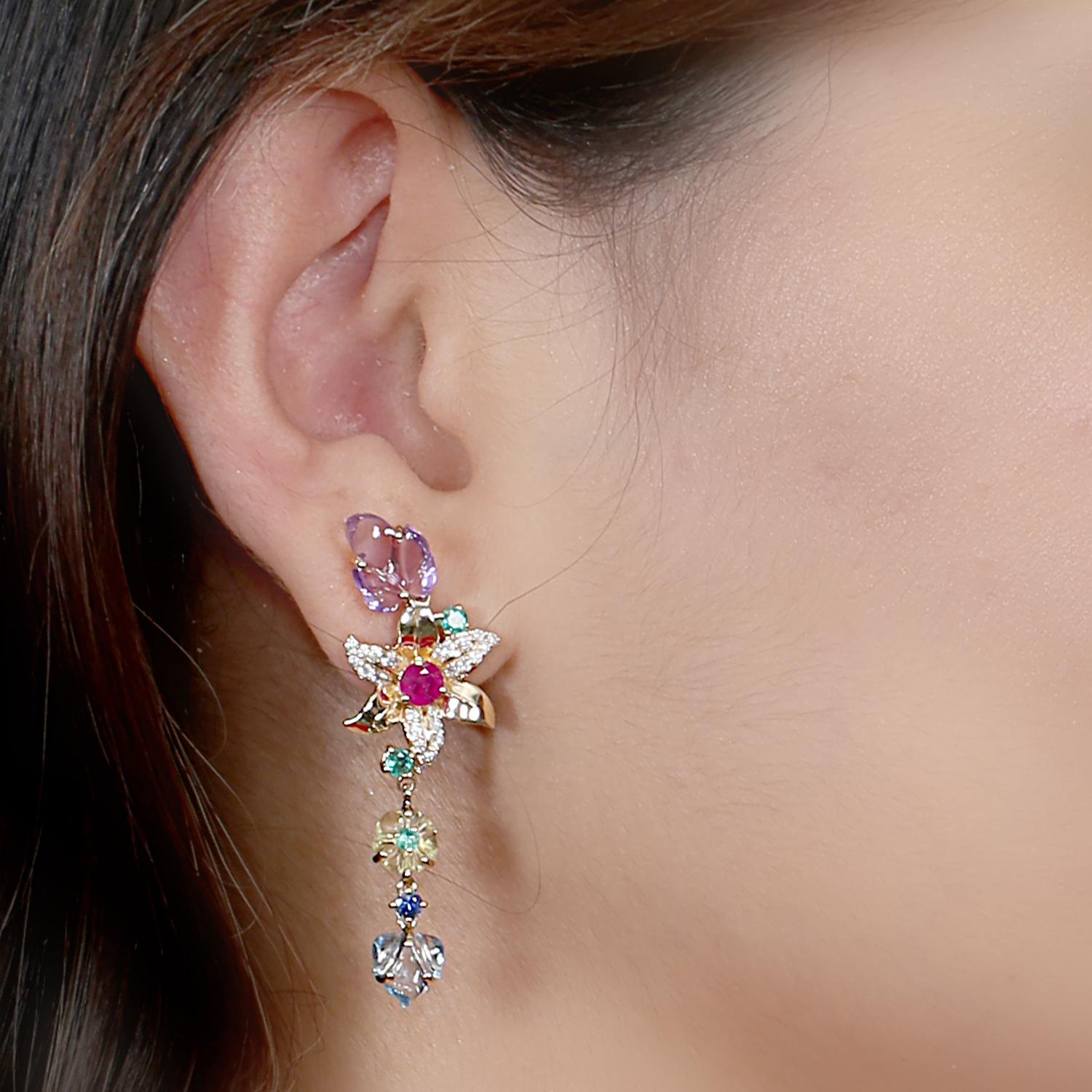 Cast in 18-karat gold. These beautiful earrings are set with 6.76 carats of carved multi gemstone, emerald, topaz, amethyst, citrine, ruby and .45 carats of sparkling diamonds.  See other flower collection matching pieces.

FOLLOW  MEGHNA JEWELS