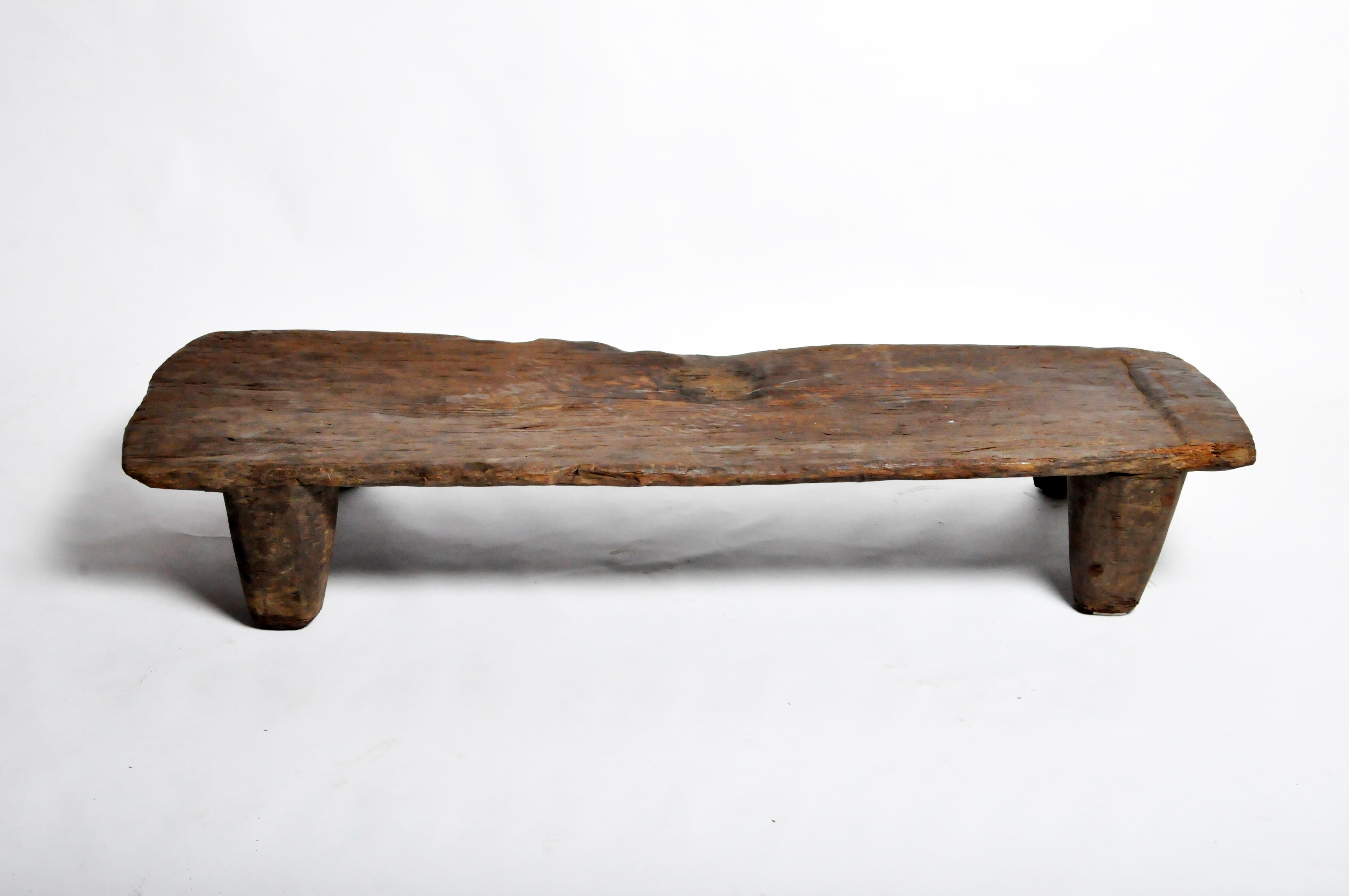 The Naga tribesman slept on elevated wooden beds to keep off the moist earth in their huts. Like most Naga artifacts, this bed is carved from a single piece of wood.
 
