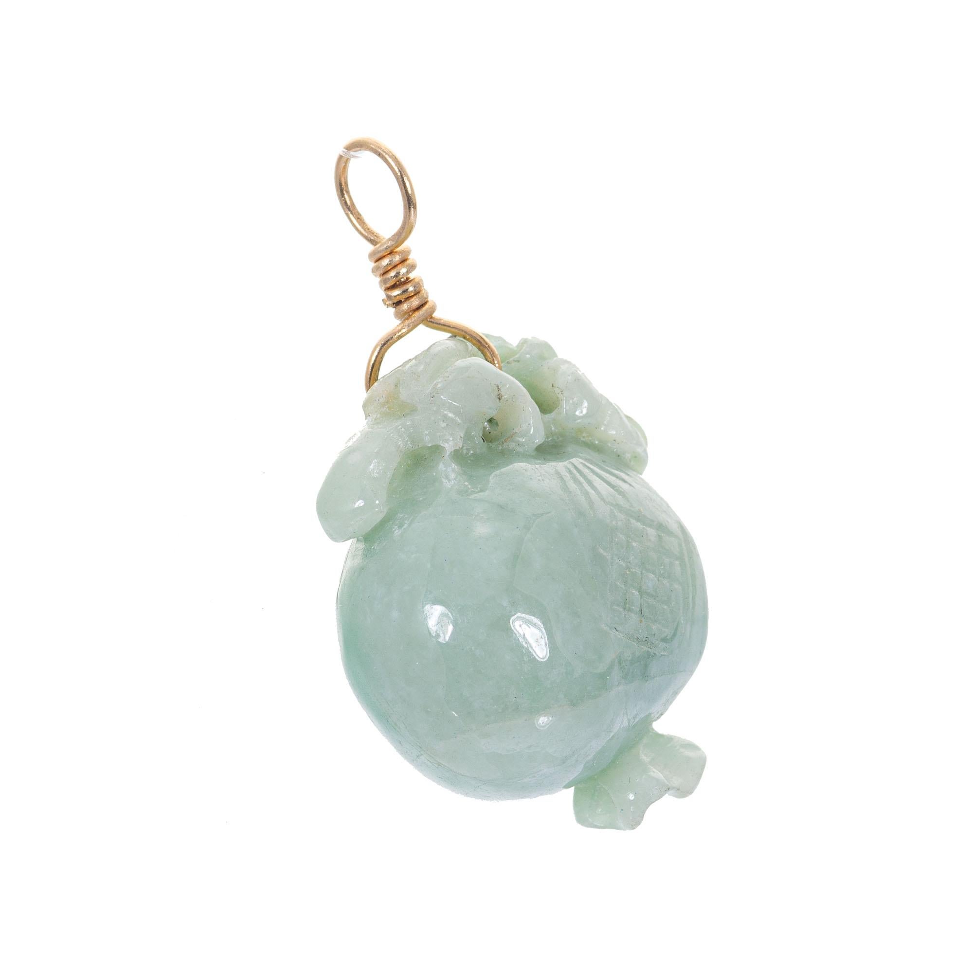 Natural GIA certified Jadeite Jade natural color pendant with hand wrapped 14k yellow gold wire top.

1 pierced carved green natural Jadeite Jade, 23.48 x 19.11 x 14.83mm, GIA certificate #2183037947
14k yellow gold
9.8 grams
Tested: 14k
Top to