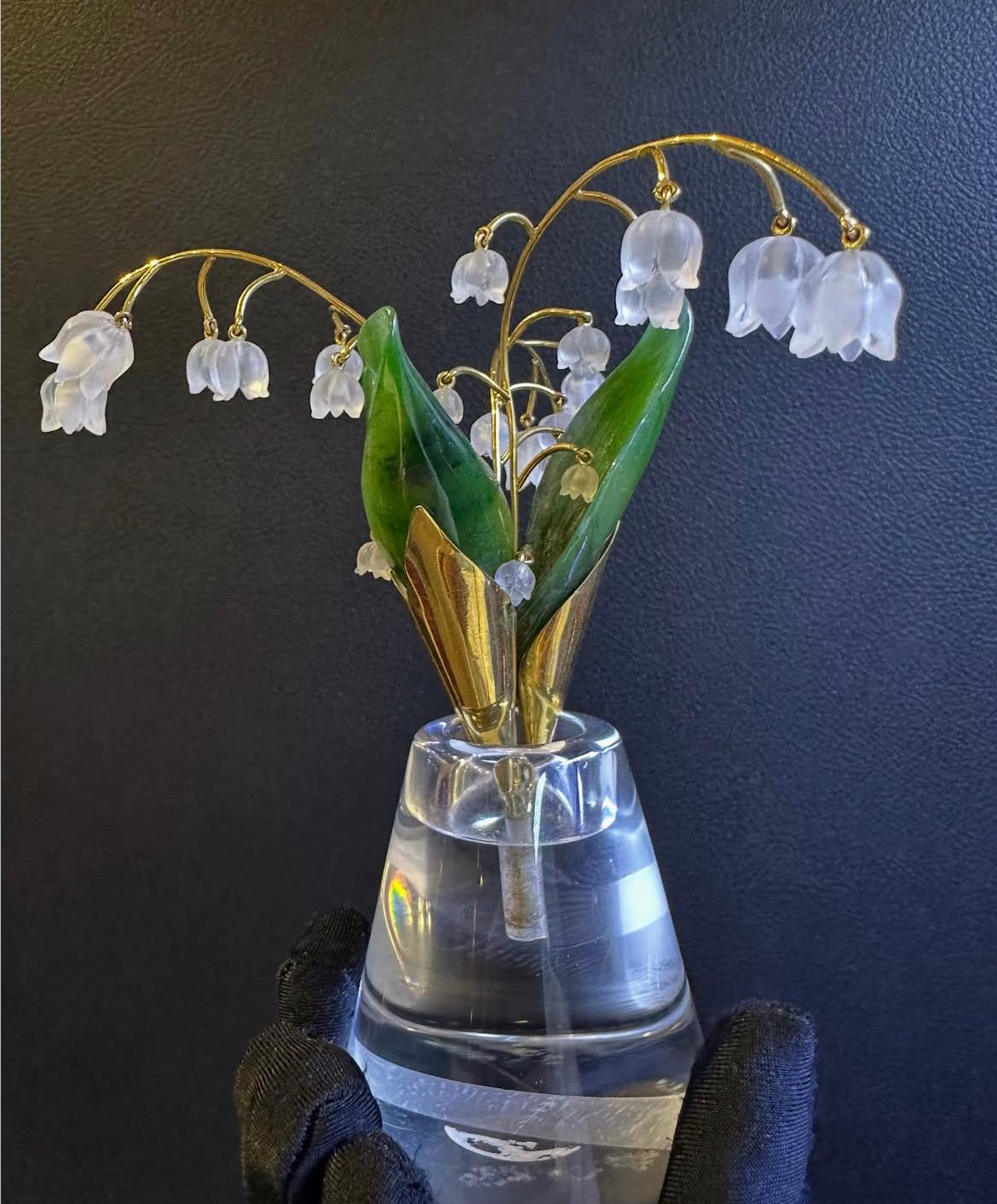 Carved Nephrite and Rock Crystal Gold Flower Pot

This flower pot features en tremblant rock crystal-carved Lilly of the Valley flowers, nephrite leaves, and gold stems. The base is made of clear rock crystal.

Approximate Height: 4.5 inches
Metal