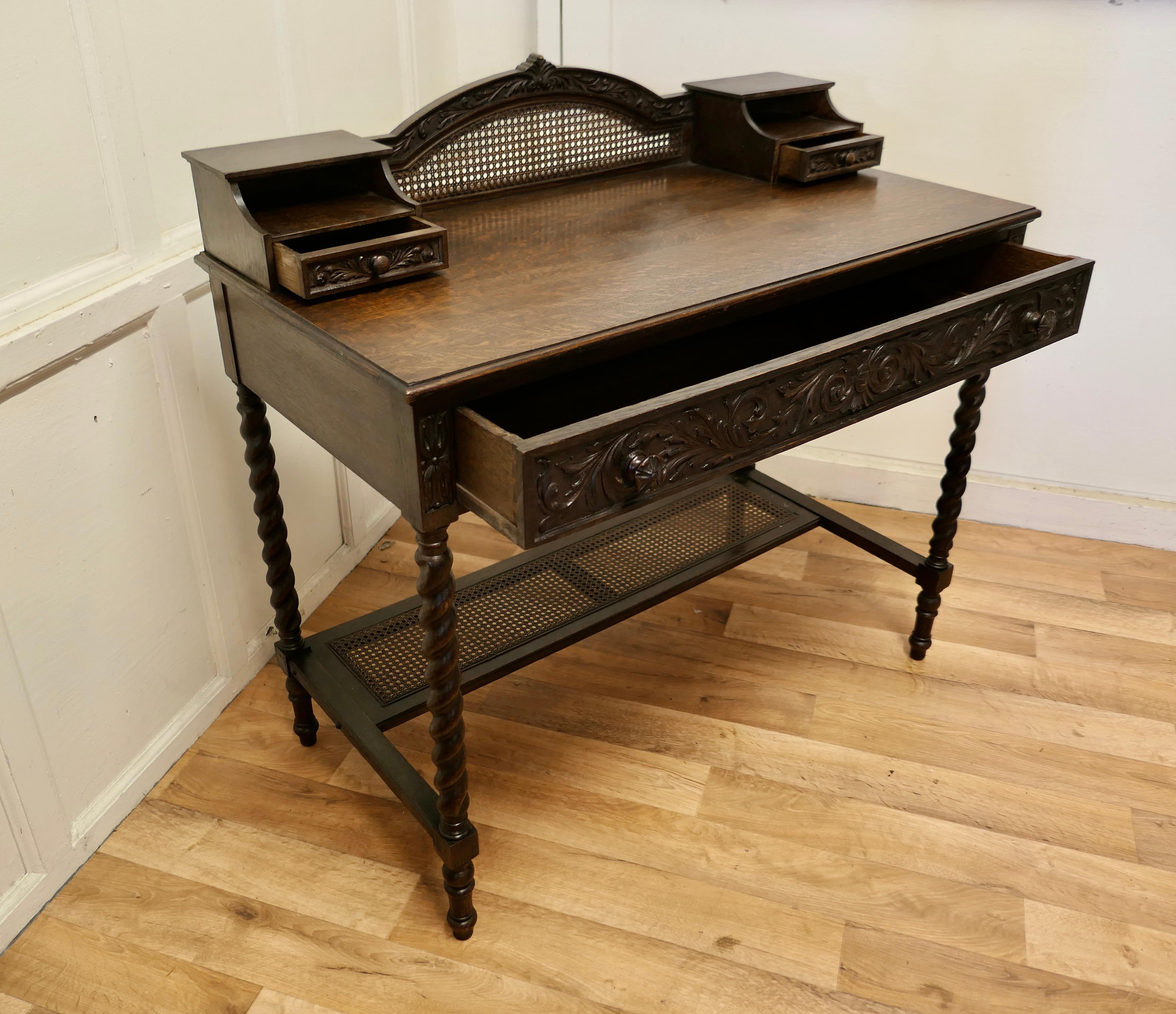 Carved oak and rattan reception desk


The Desk stands on slender barley twist turned legs with a long Bergèr stretcher towards the back, this matches the arched gallery at the top
The Desk has one long drawer with a beautifully carved frieze
