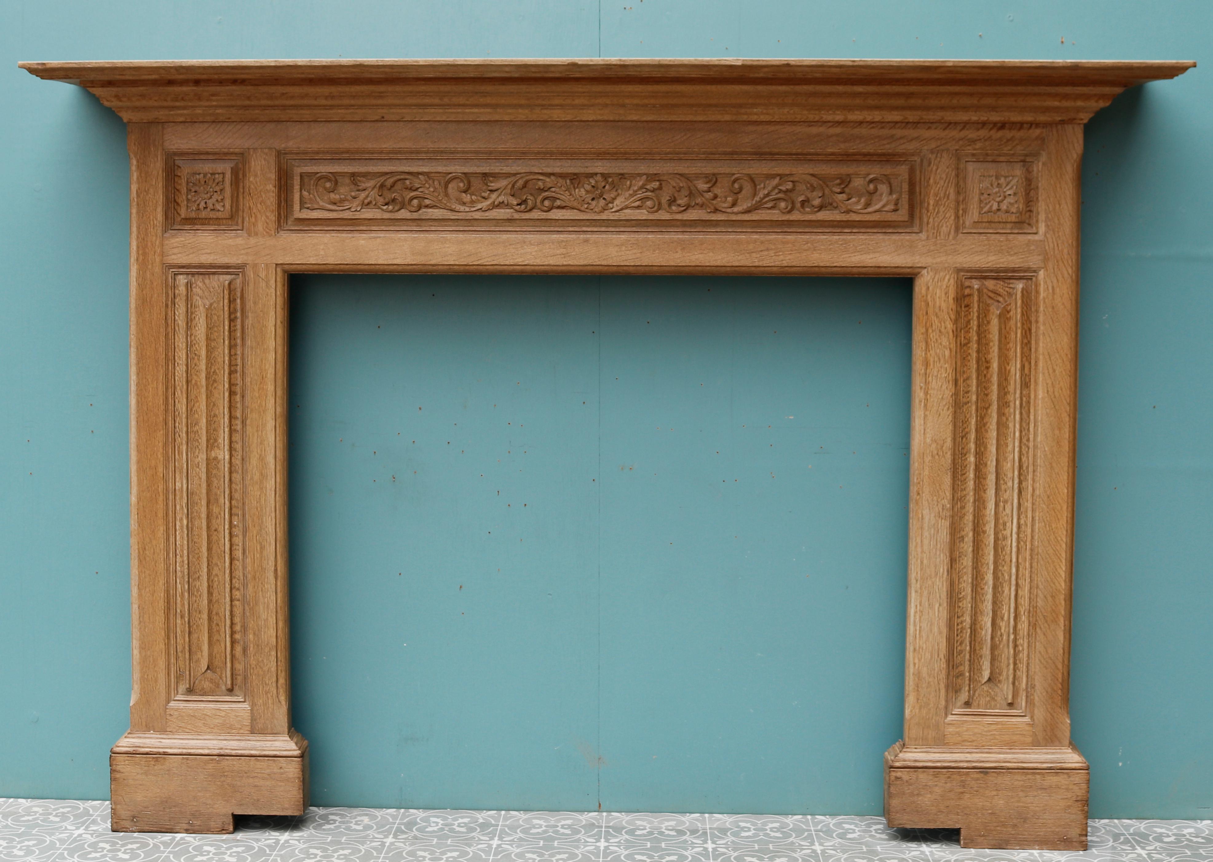 A large English carved oak fireplace. The frieze panel carved with foliage, paterae end blocks and carved linen fold jambs.

Additional dimensions:

Opening height 106 cm

Opening width 118 cm

Width between outsides of the foot blocks 184