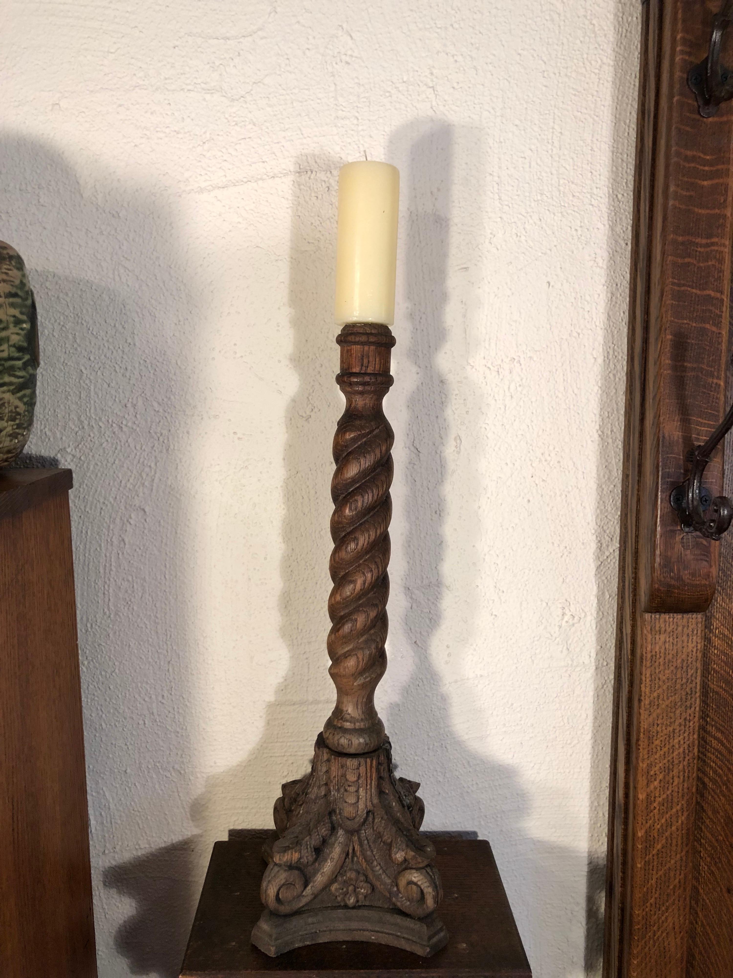 Carved oak barley twist candlestick. Columned base with heavily detailed carvings. Nice addition to any arts and crafts home. This item will parcel ship for $45.