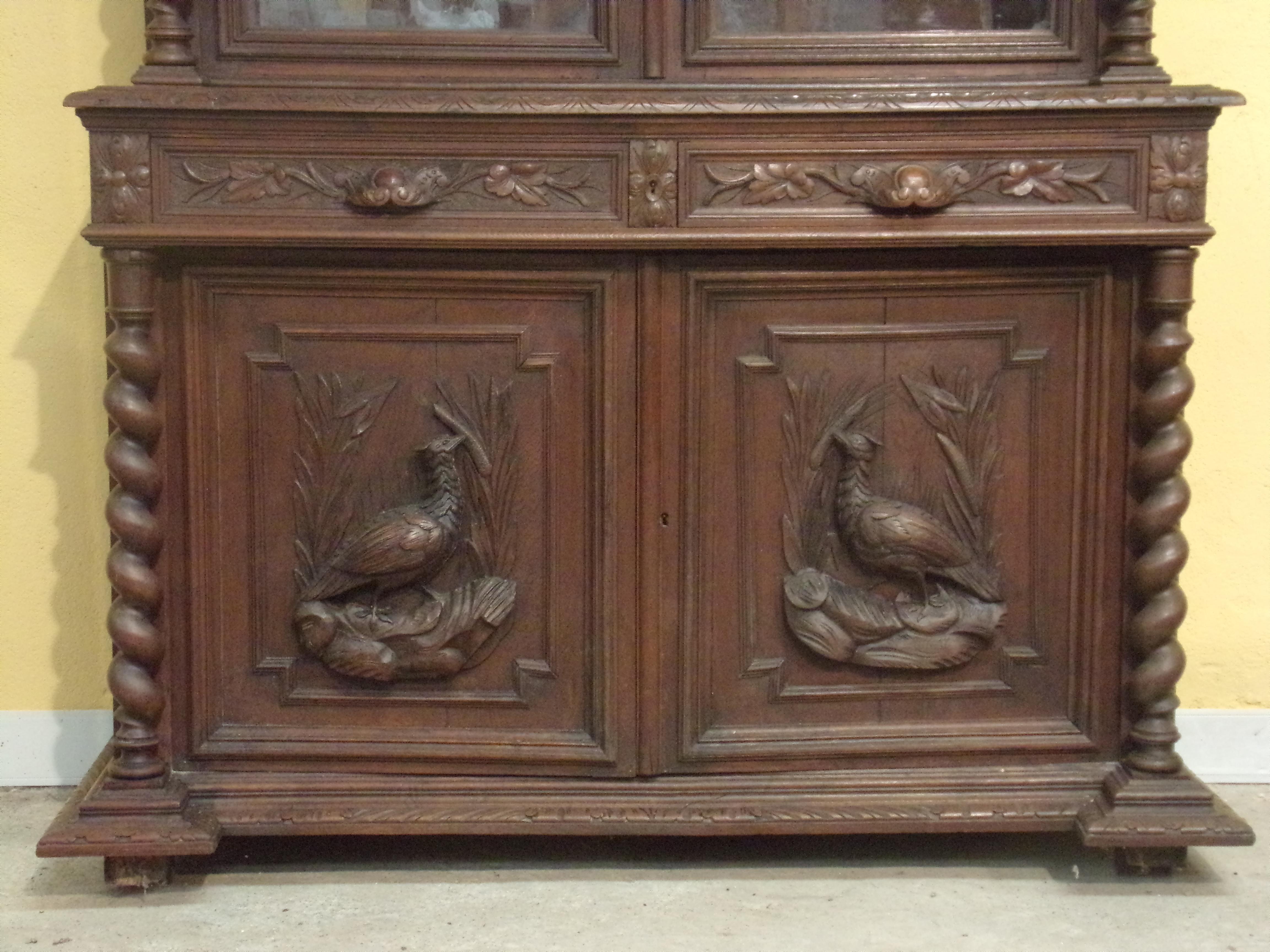 Good quality hand carved oak bookcase / Gun cupboard in the Louis XIII style C1890 - This piece can be sold with fittings to hold up to 6 guns at no extra charge - see our photographs of a similar piece which has been converted. Two glazed upper