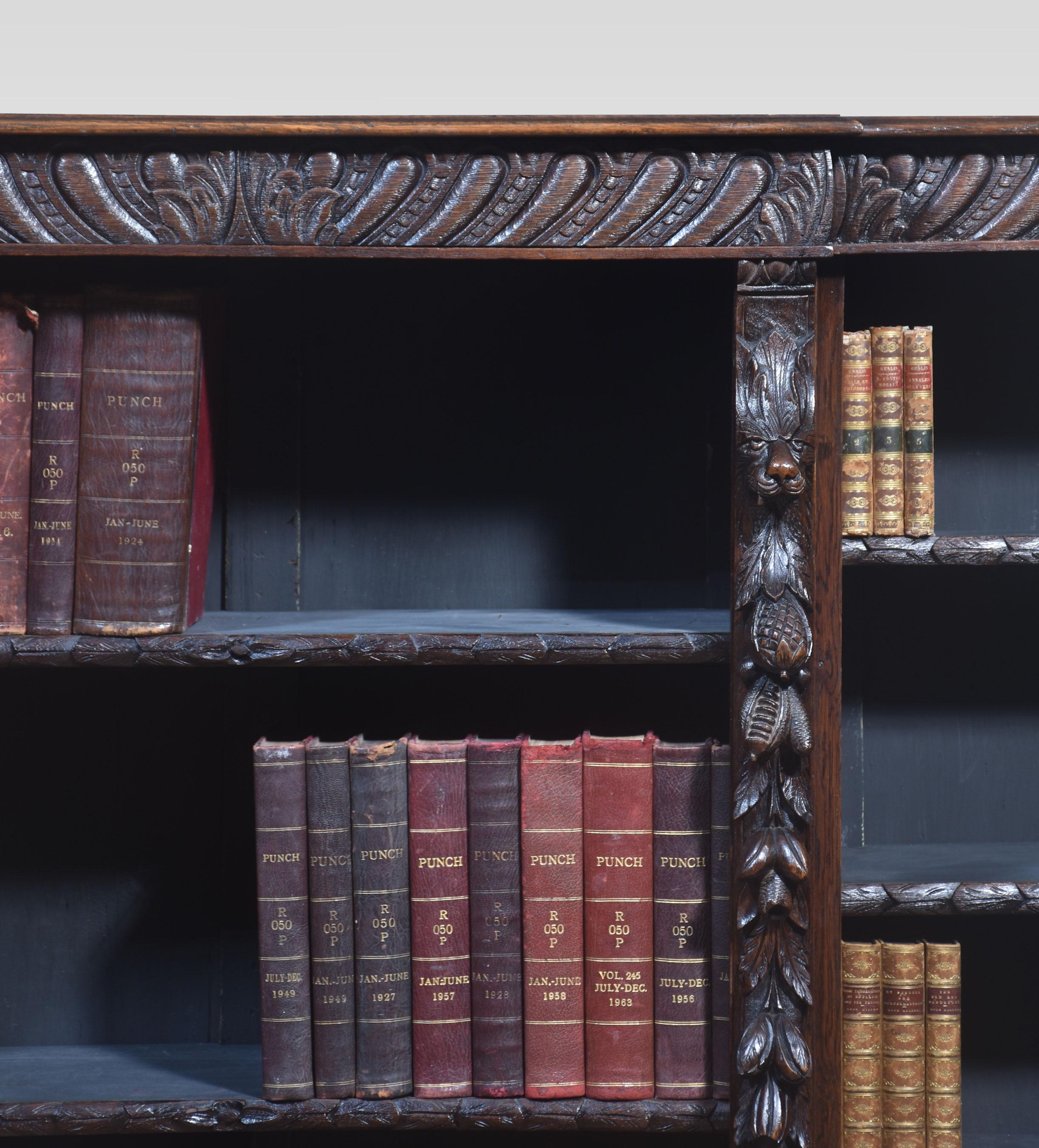 Heavily carved open bookcase the large rectangular breakfront top with carved moulded edge. Above three bays of adjustable shelves flanked by carved columns to the base all raised top on a shaped plinth.
Dimensions
Height 51 Inches
Width 81.5