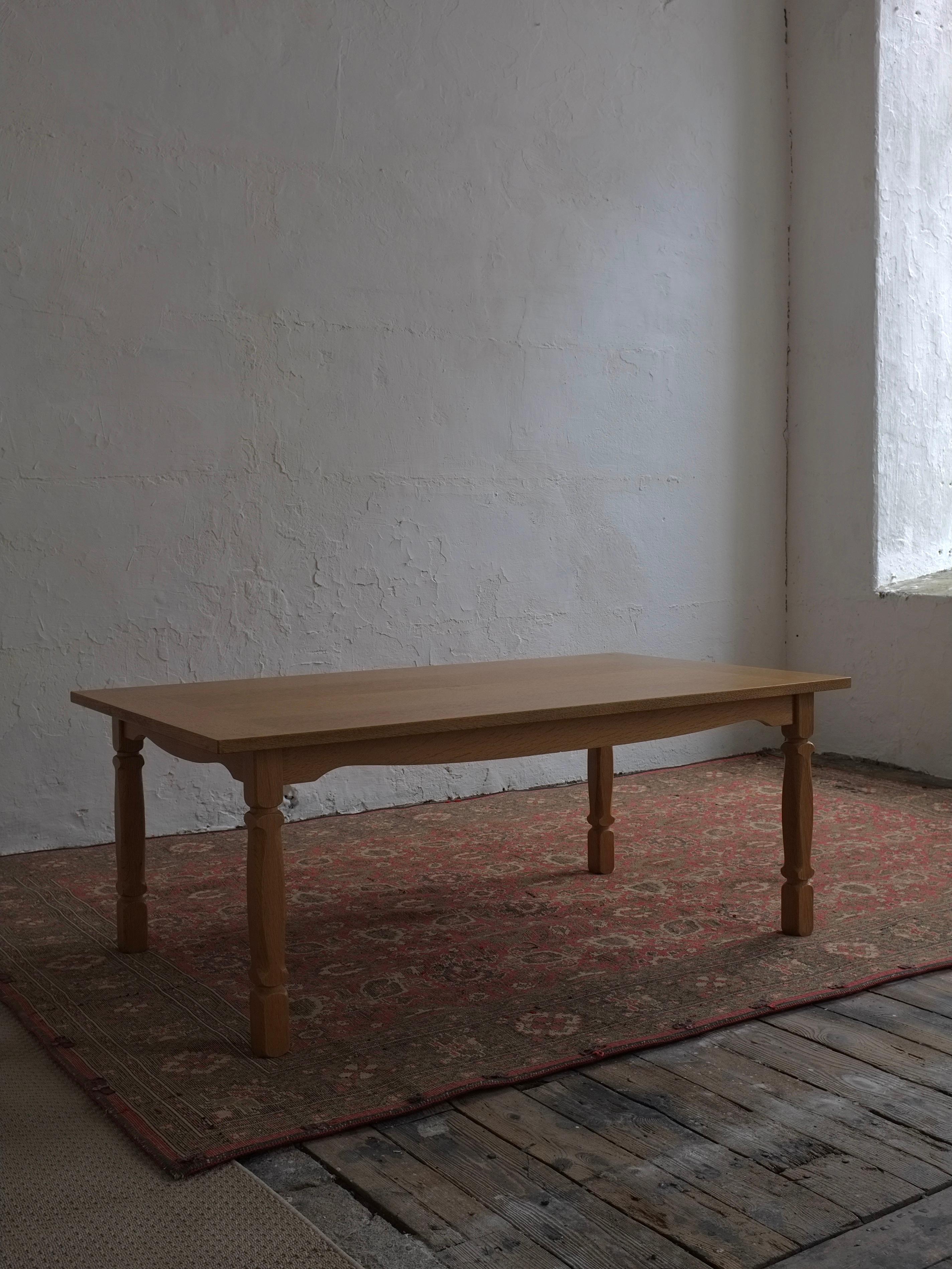 Carved solid oak rectangular coffee table designed by Henning Kjaernulf in the 1950s.  I have a set of 6 chairs, several tables by Henning Kjaernulf, and sideboards; please ask if you’re interested.  You may see the example of a square table with a