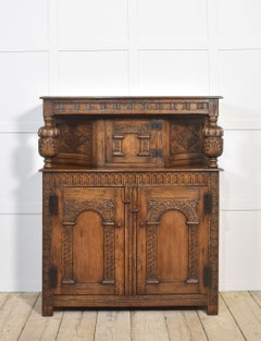 Carved oak court cupboard