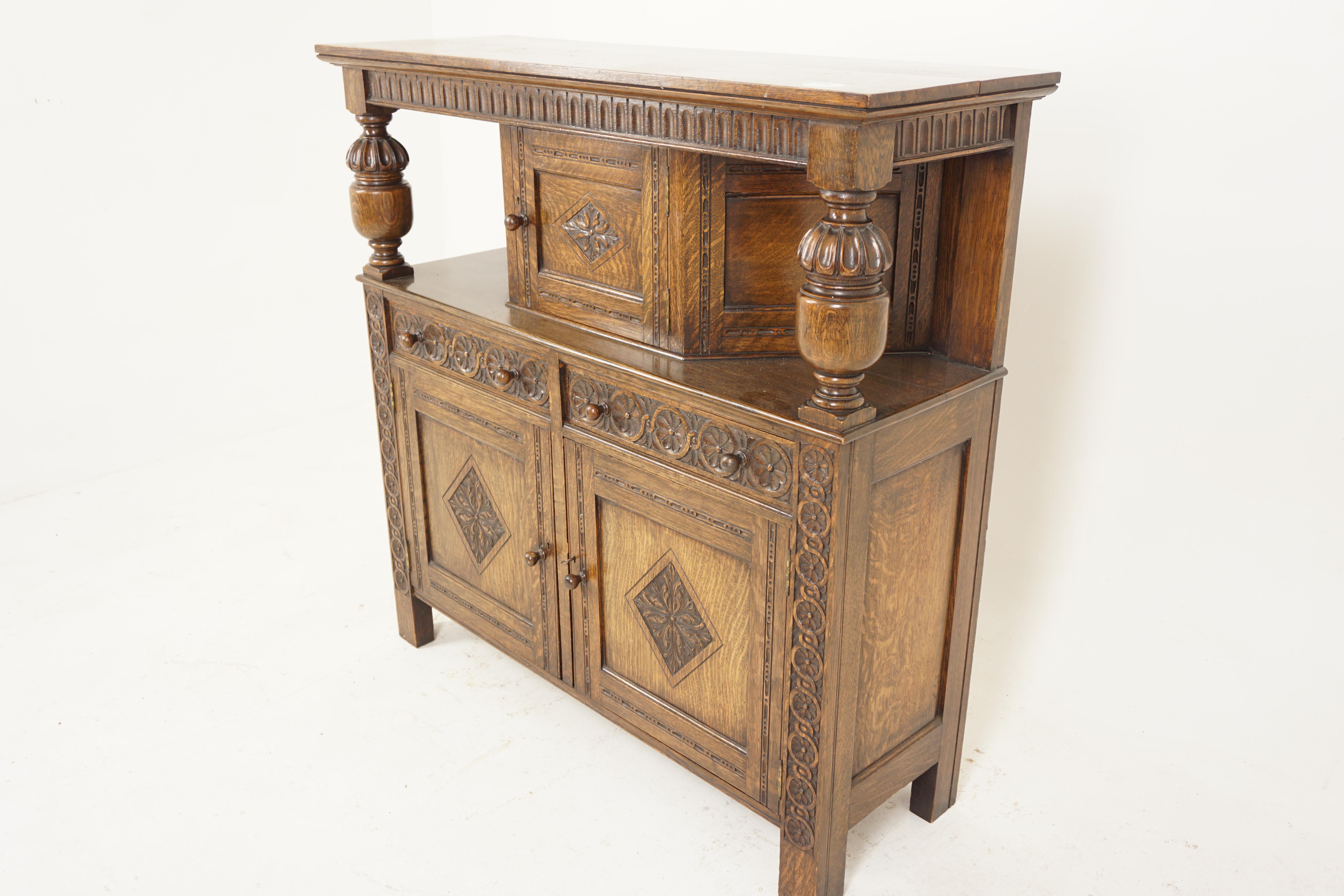 Vintage carved oak court cupboard, sideboard, buffet, Chiffonier, Scotland 1930, H689

Scotland 1930
Solid Carved Oak
Original Finish
Rectangular top with carved frieze
Shaped cupboard under with cupboard
Door to the center opens to reveal storage