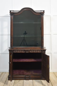 Carved oak display cabinet