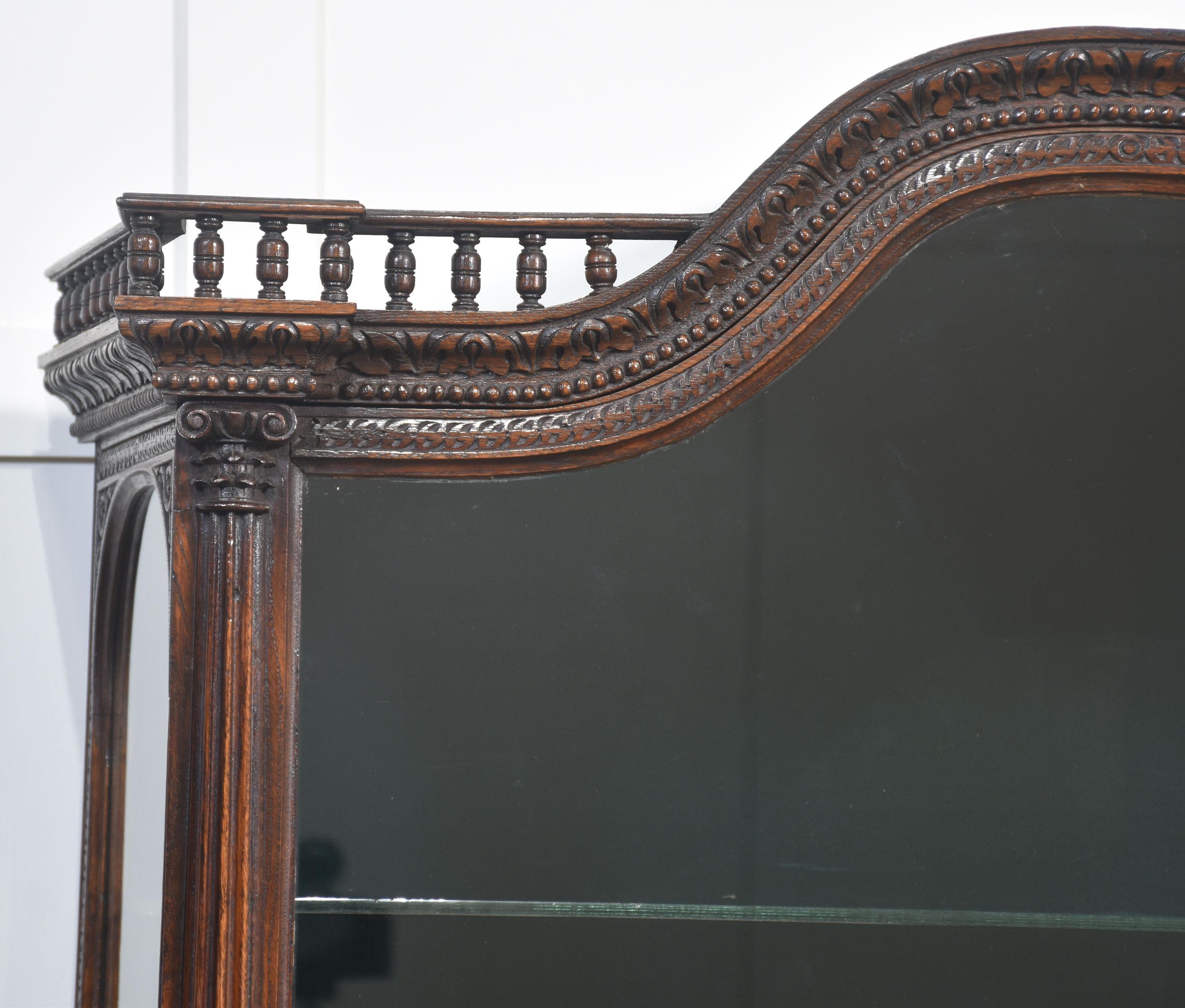 British Carved oak display cabinet For Sale