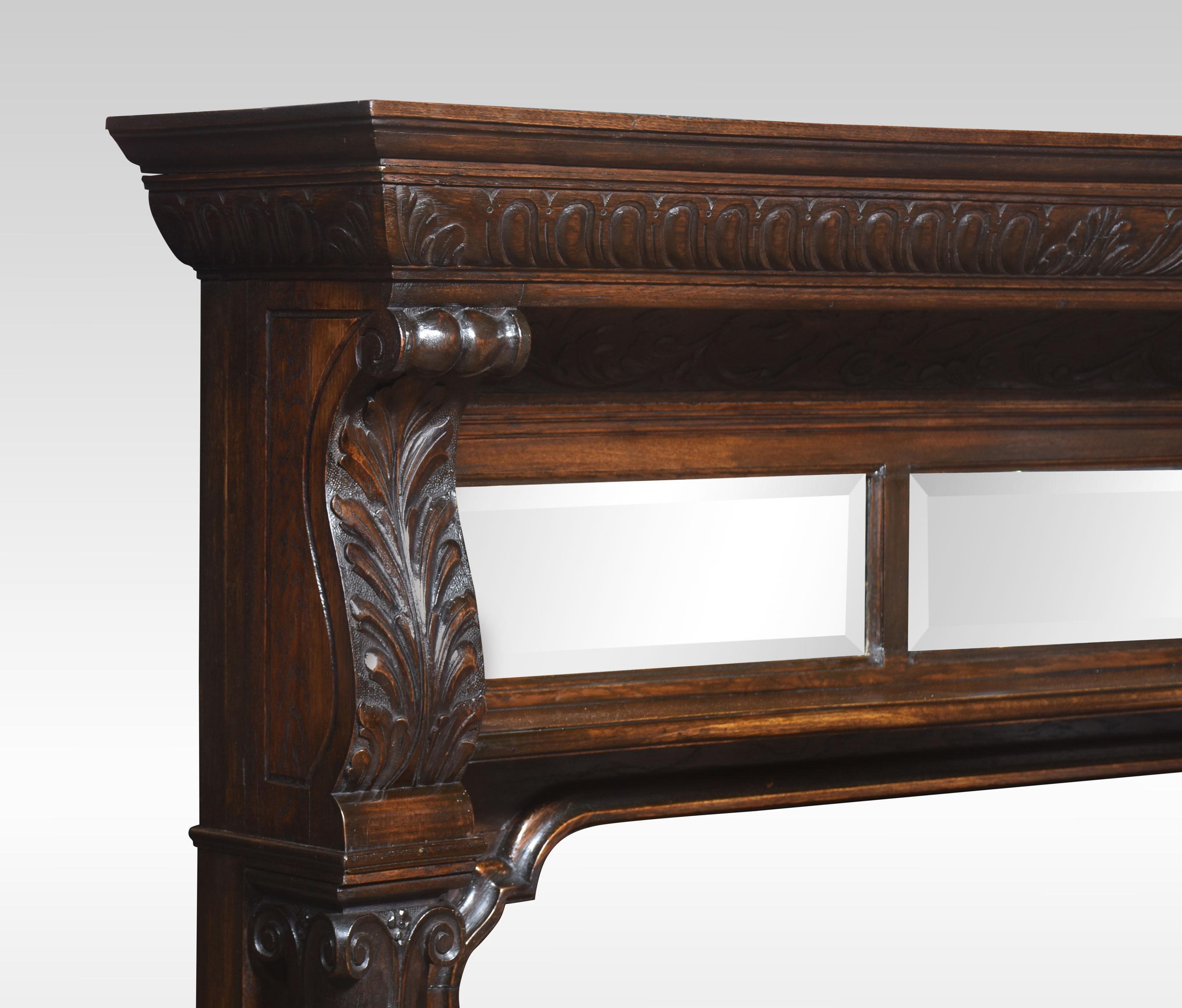Carved oak fire surround, the rectangular mantle above carved detail. to the acanthus capitals flanking two original bevelled mirrors. Supposed on bold reeded carved pillars.
Dimensions
Height 62.5 Inches
Width 63.5 Inches
Depth 13 Inches

Internal