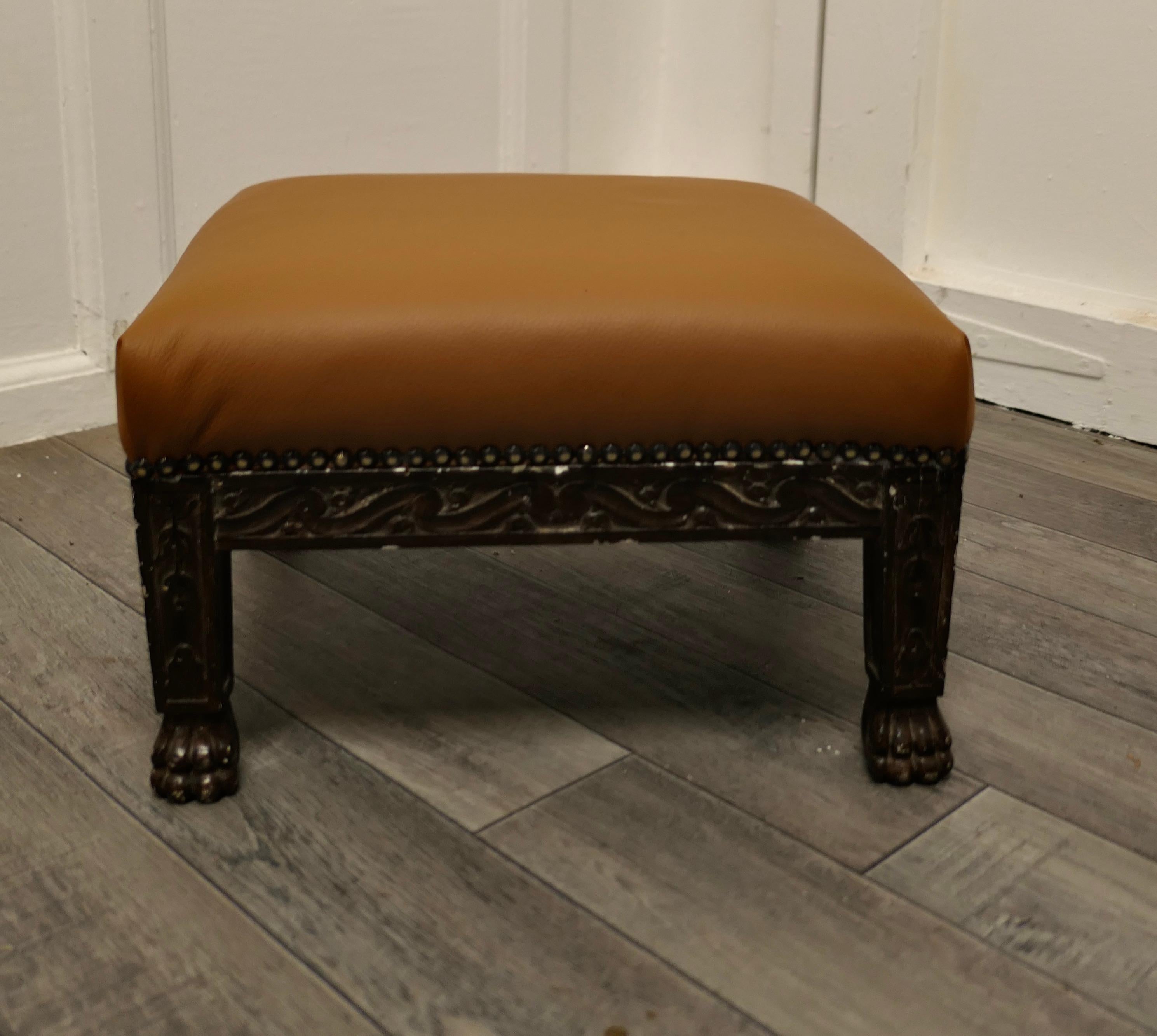 Carved oak foot stool upholstered in leather.

A lovely piece, this Victorian stool is made in carved oak, it stands on short carved hairy paw feet and has been upholstered in tan leather.

The stool, is in good condition, it is 9” high, 13”