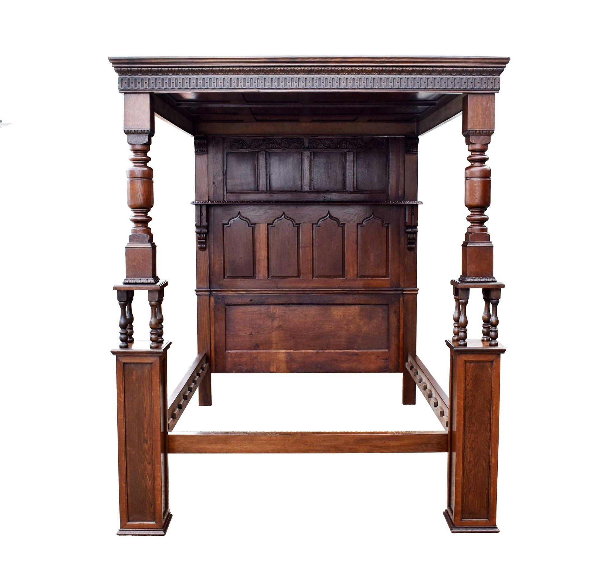 For sale is a part 18th century carved oak four poster bed, having a paneled canopy surrounded by ornate carvings, above the paneled headboard. The canopy is supported by two turned oak columns. The bed is in very good condition. 
 
Width: 177cm