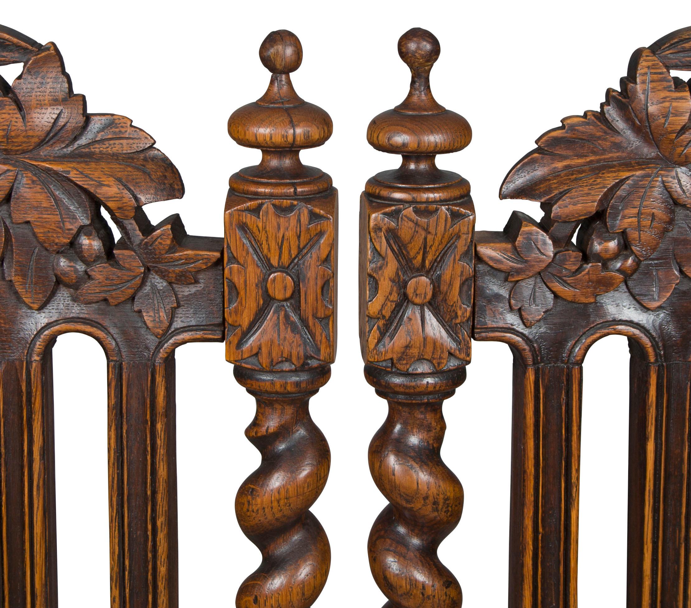 This set of six French Provincial dining room chairs are done in a stunning, hand carved oak. Barley twist columns on the back rests, front, and stretchers provide an extremely elegant look. Almost every part of the oak frames are covered in hand