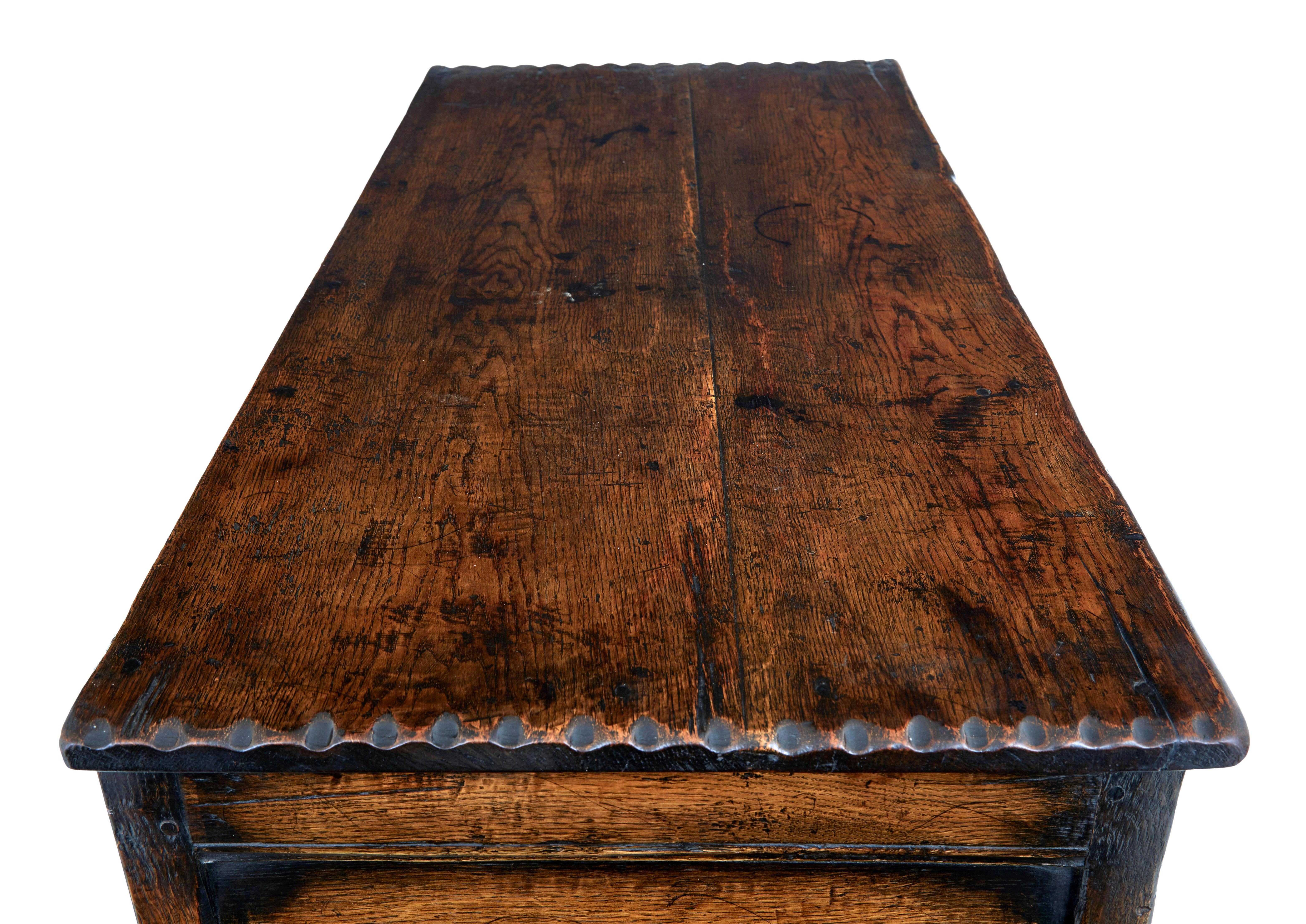 Carved oak gothic revival food cupboard 1980.

Large english made gothic style cupboard, known as a food cupboard.  Front comprises of 6 pierced carved panels, depicting tracery elements, tools and wheat.  2 of these panels are hinged doors which