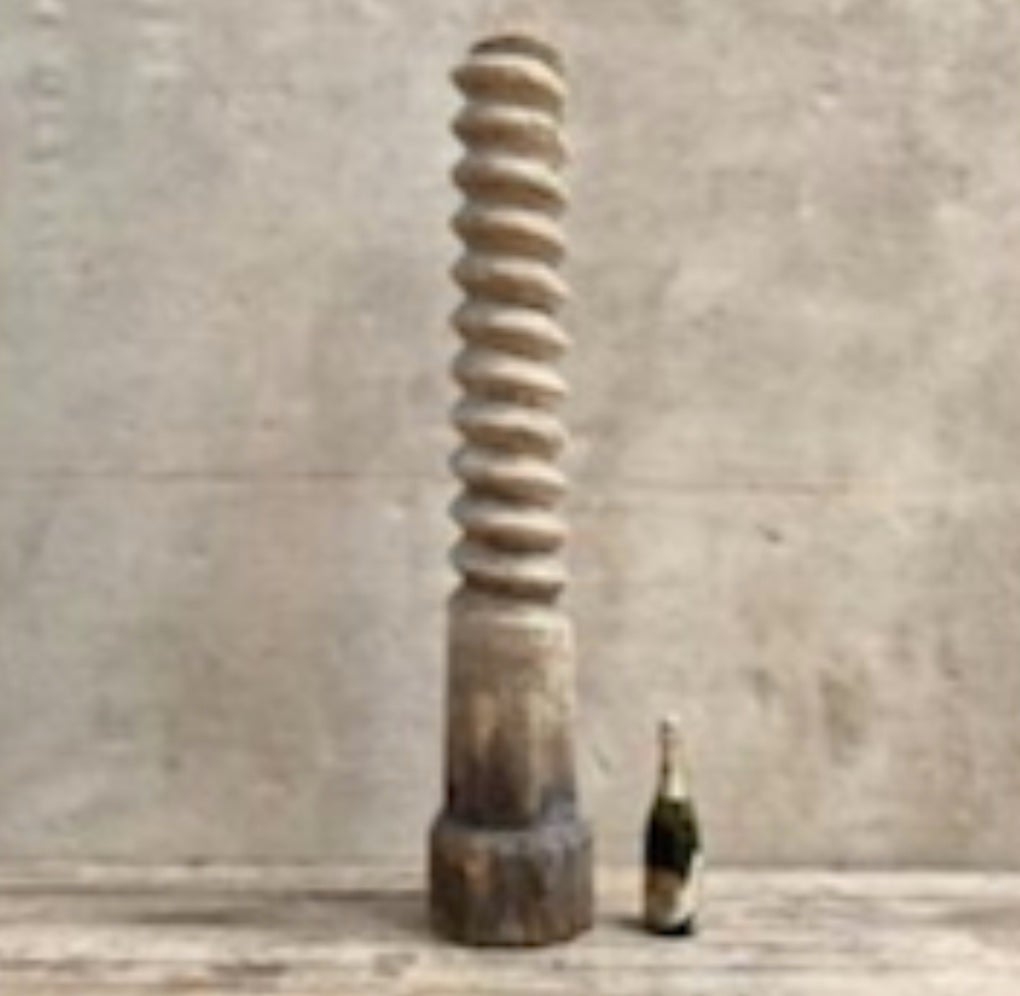 Rustic carved wooden grape press screw, originally used in the production of wine. With its interesting surface texture and strong vertical thrust, the piece would be great as an element of sculpture.

France, circa 1810

Dimensions: 53H x 10D

