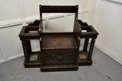 Carved Oak Green Man Hall Settle, with Sick Stands