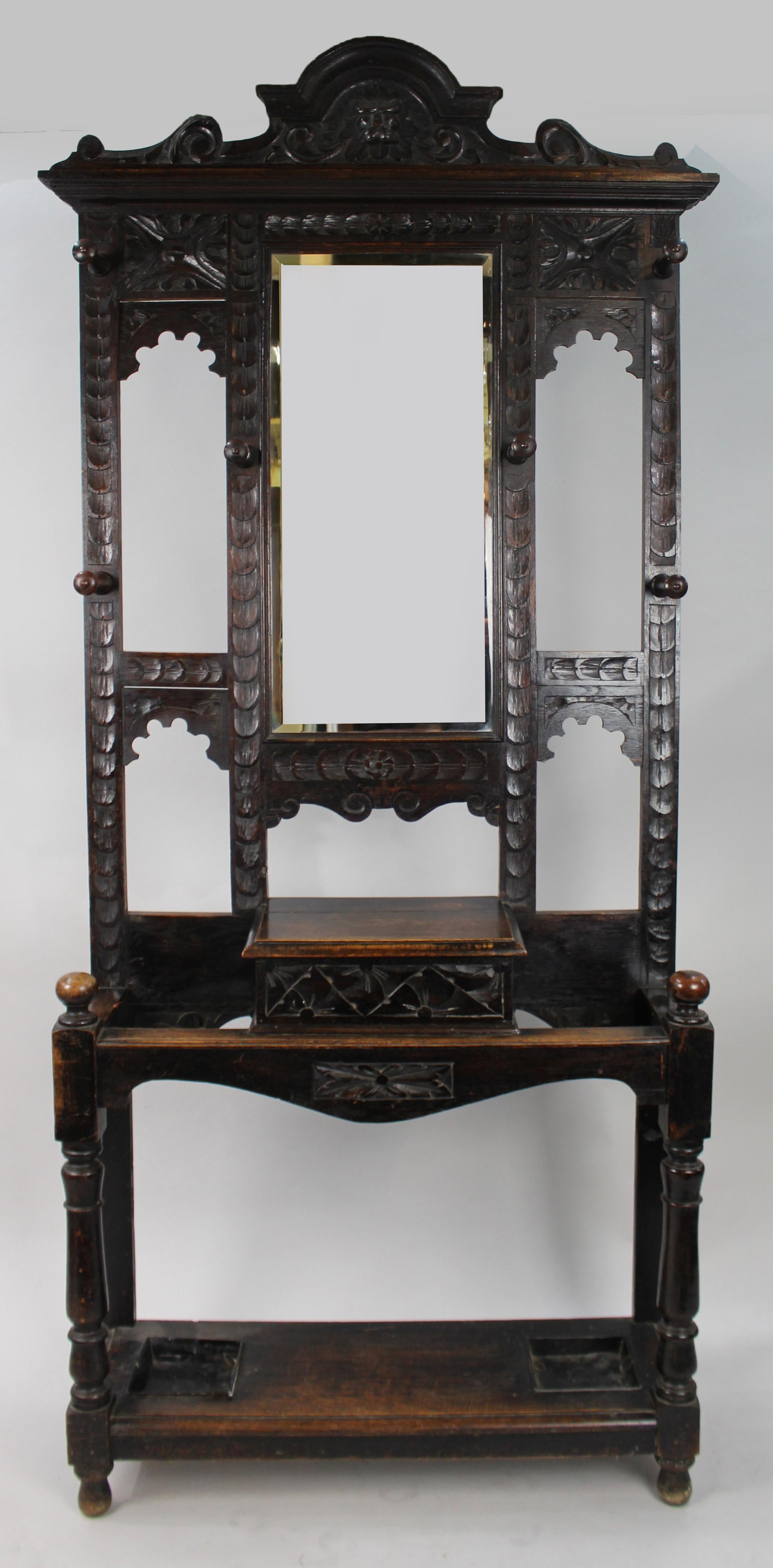 Carved Oak Green Man Victorian Hall Stand


c. 1880, English

Offered for sale, a handsome and impressive Victorian dark oak hallstand. Carved oak frame with decorative 'Green Man' mask to the pediment. Six turned hat pegs. Bevelled portrait