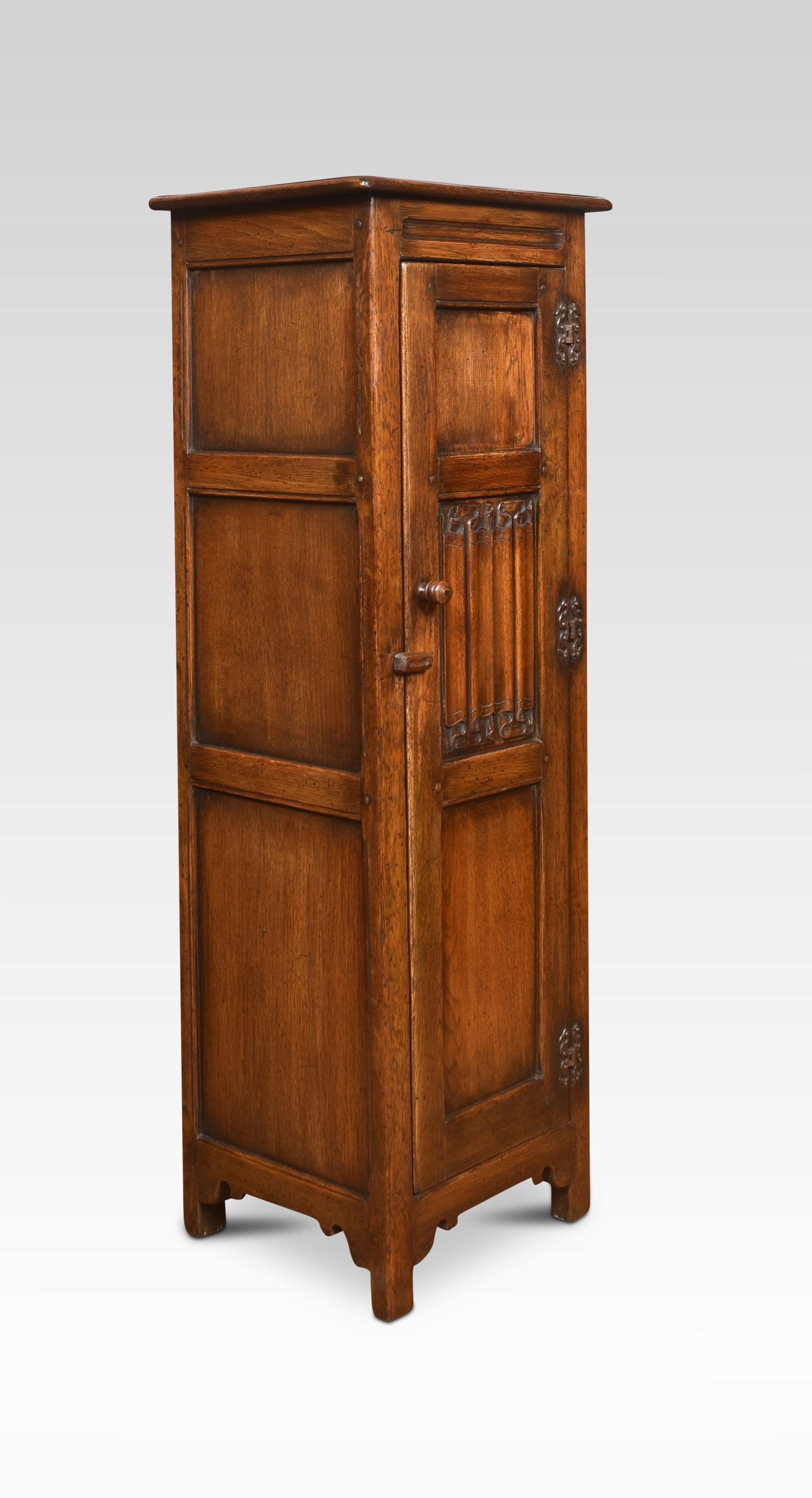 Carved oak bonnetiere petite armoire of small proportions, the moulded cornice to the long cupboard door with linen fold decoration. Opening to reveal a shelved interior. All raised up on style feet.
Dimensions
Height 54 inches
Width 17.5