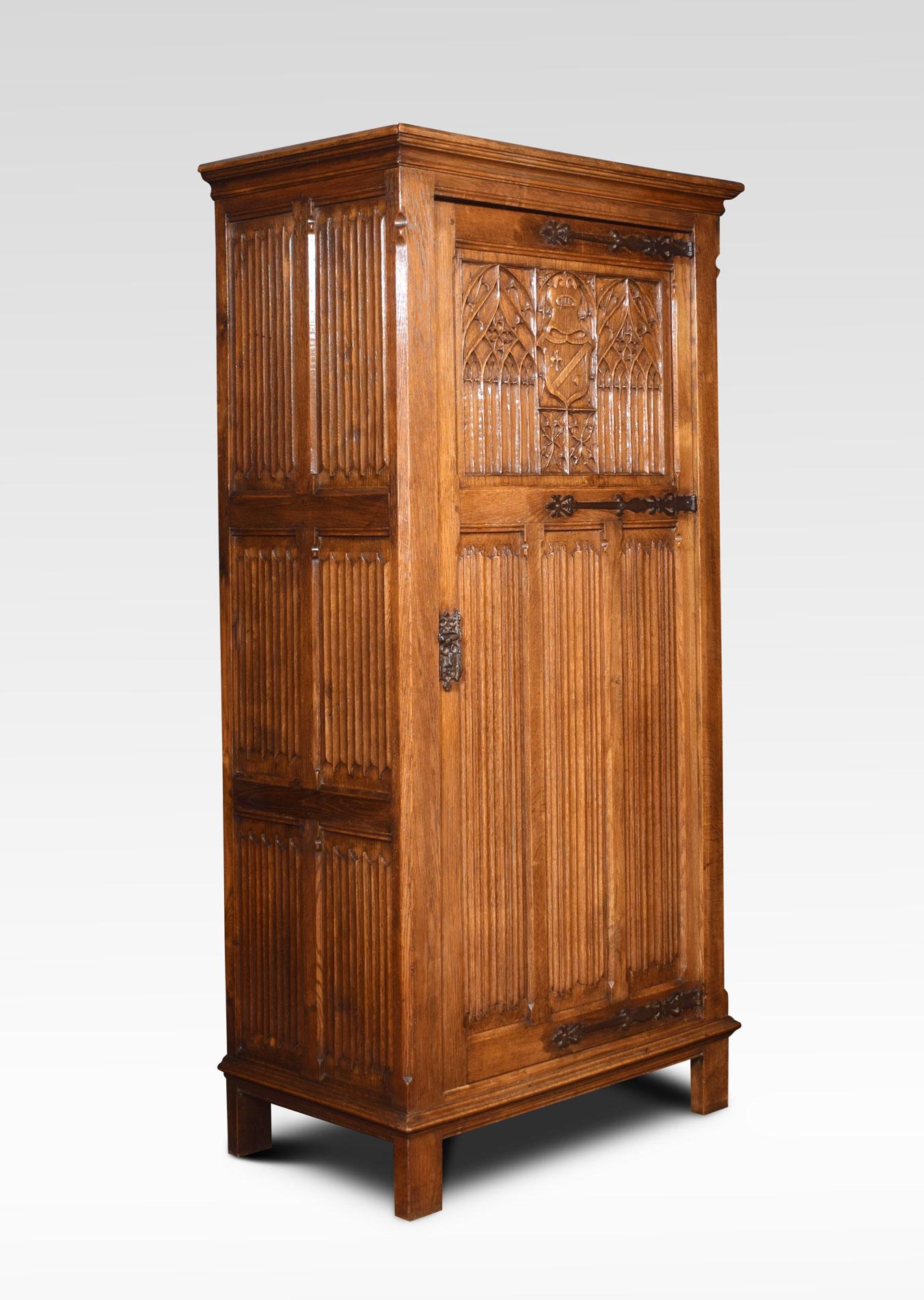 Solid oak wardrobe the moulded cornice above the large door with cast strap hinges Gothic tracery and linenfold decoration. Opening to reveal large hanging area and shelf to the top. All raised up on bracket feet
Dimensions
Height 70.5