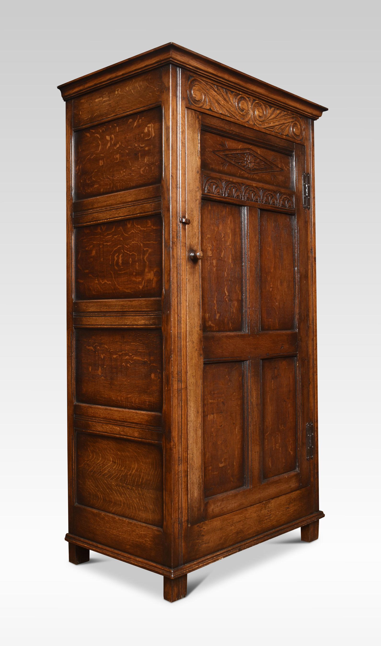 Solid oak hall robe the molded cornice above the large paneled door with carved scrolling decoration. Opening to reveal hanging area. All raised up on bracket feet.
Dimensions
Height 69.5 Inches
Width 36 Inches
Depth 22 Inches.