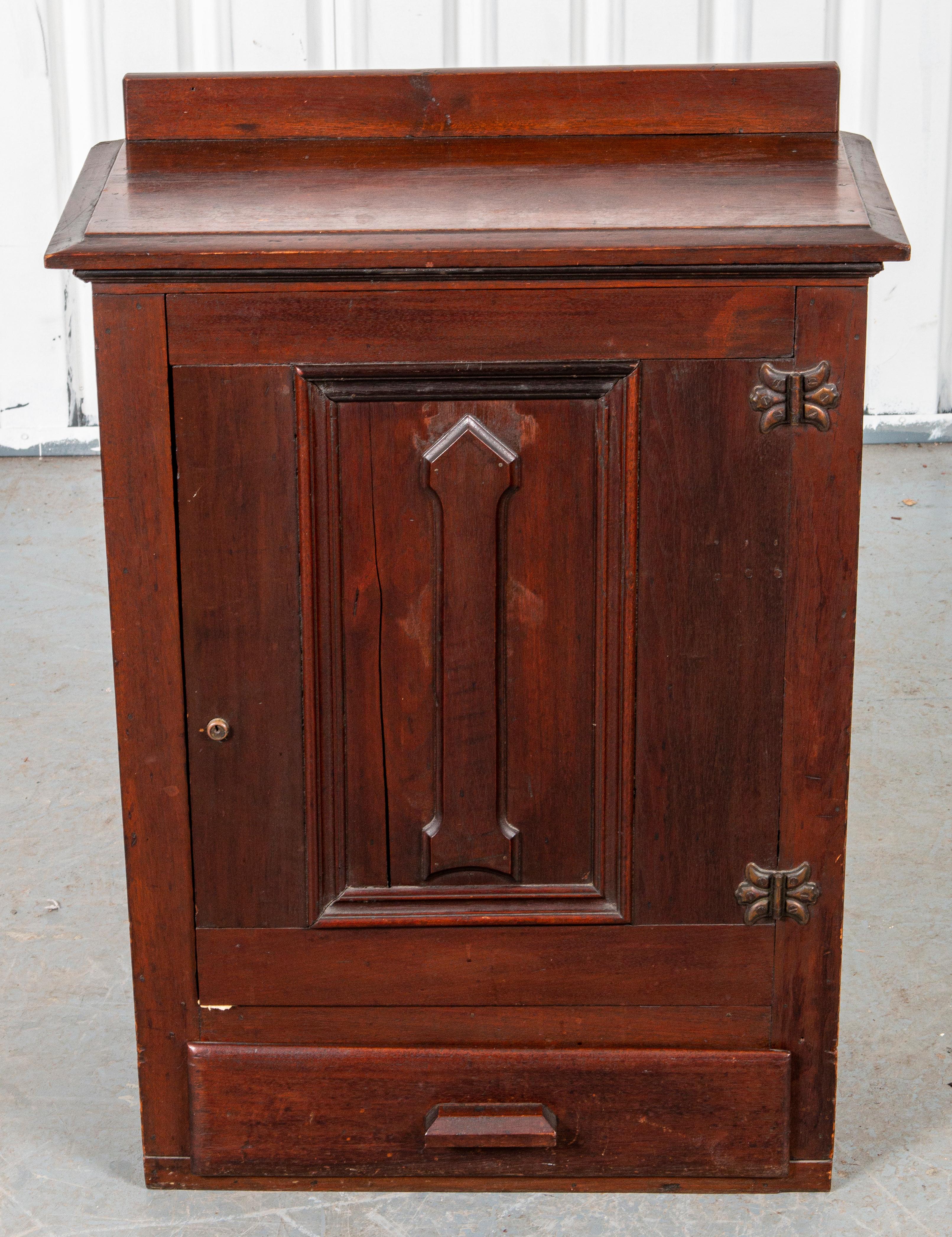 Hanging cupboard in carved oak, likely early 20th century.