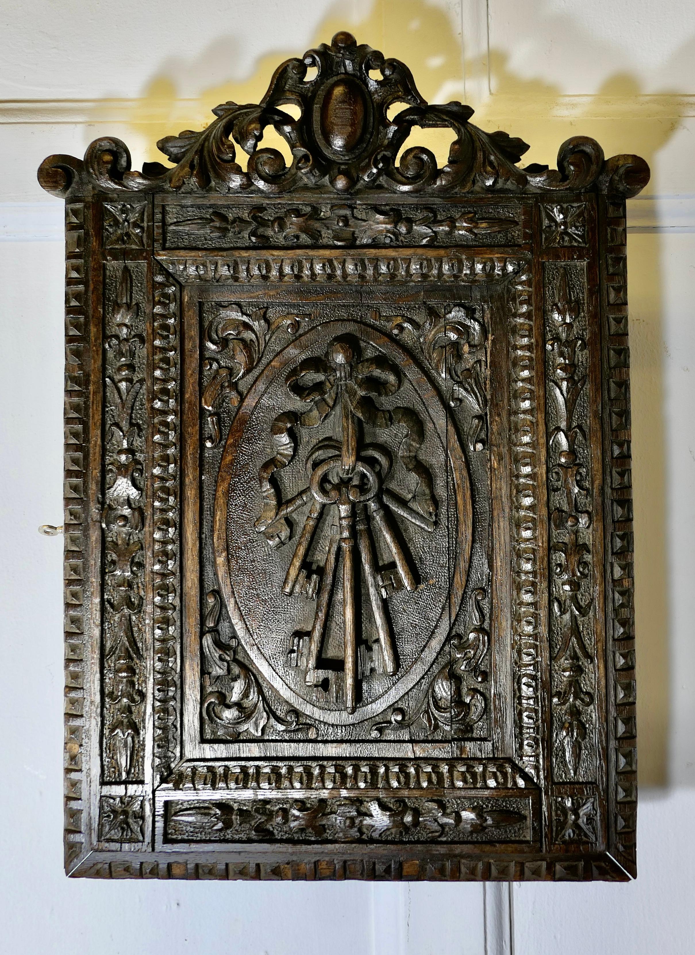 Carved Oak Key Cupboard

A very attractive piece, the cupboard can be wall hung showing the gothic carving on the front of the door to full advantage, it shows a large bunch of keys in a panel surrounded with gothic border. Inside the cupboard is