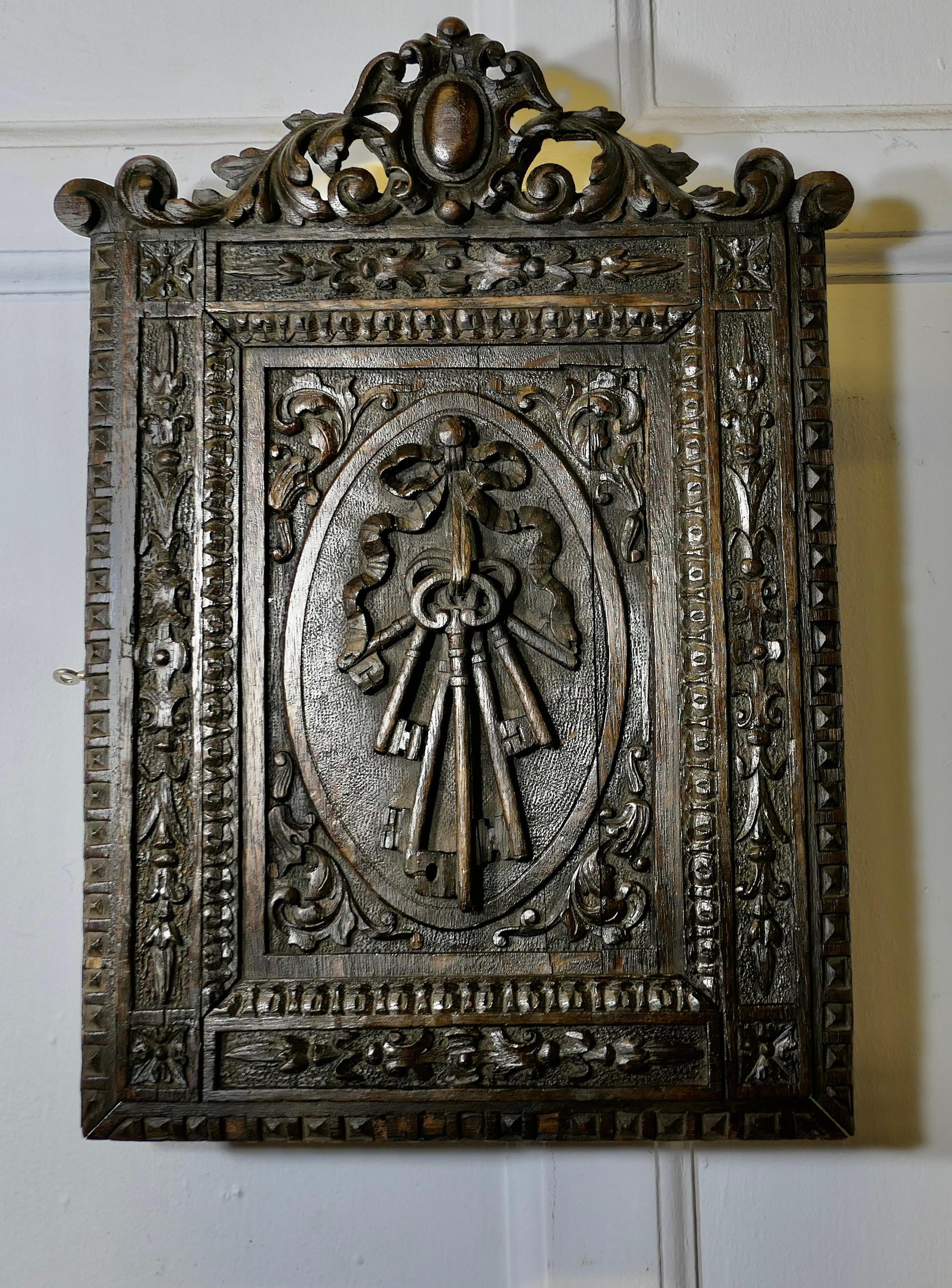 Gothic Carved Oak Key Cupboard  A very attractive piece, the cupboard can be wall hung  For Sale