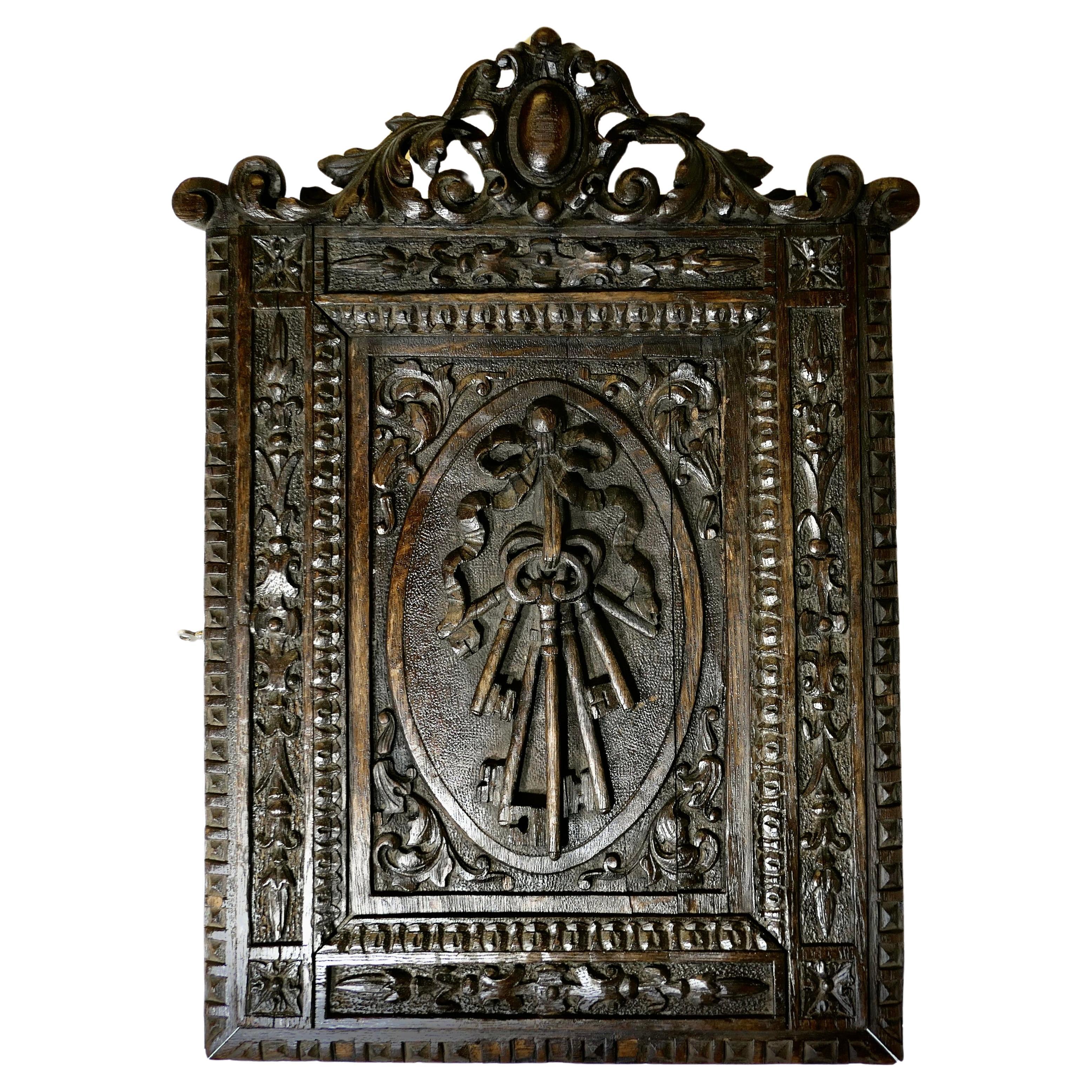 Carved Oak Key Cupboard  A very attractive piece, the cupboard can be wall hung  For Sale
