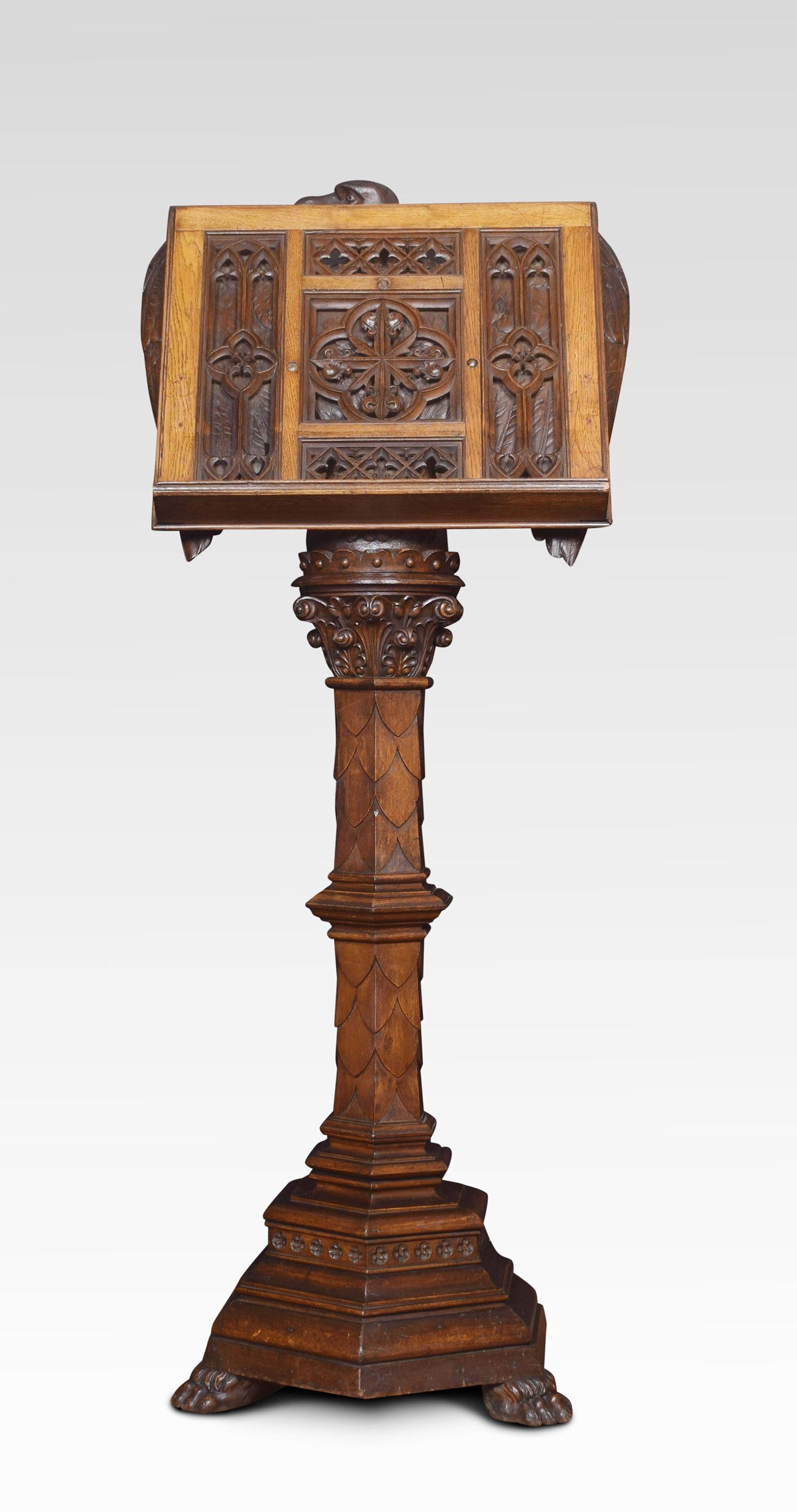 Carved oak lectern. The eagle mounted reading slope above, acanthus scroll and leaf carved column. Stepped hexagonal base terminating in paw feet.
Dimensions:
Height 68.5 inches
Width 28 inches
Depth 23 inches.