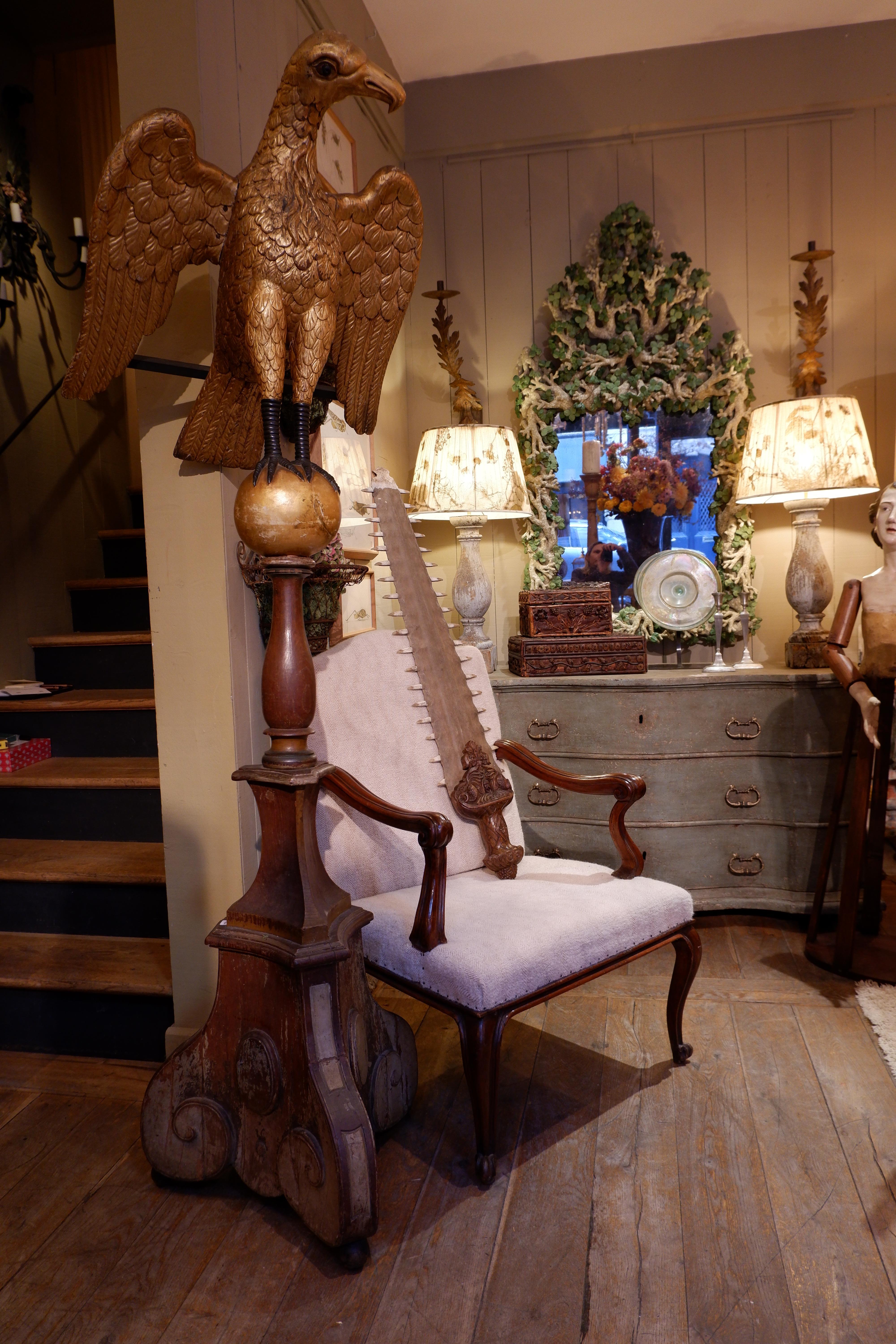 This grand 18th-century german lectern is a striking example of religious craftsmanship, featuring a magnificently carved oak eagle, richly adorned with gilded gold leaf. Standing 210 cm tall, this imposing piece is both a functional and symbolic