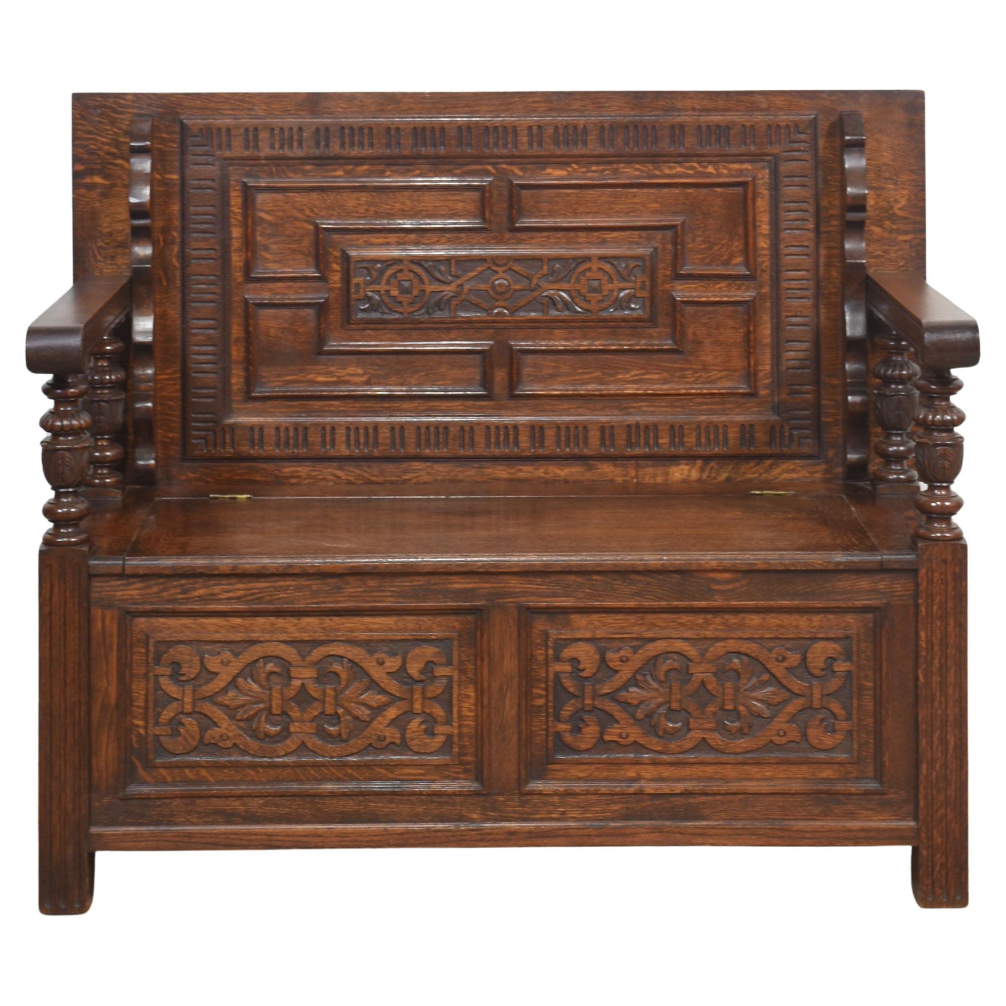 Carved oak monk’s bench