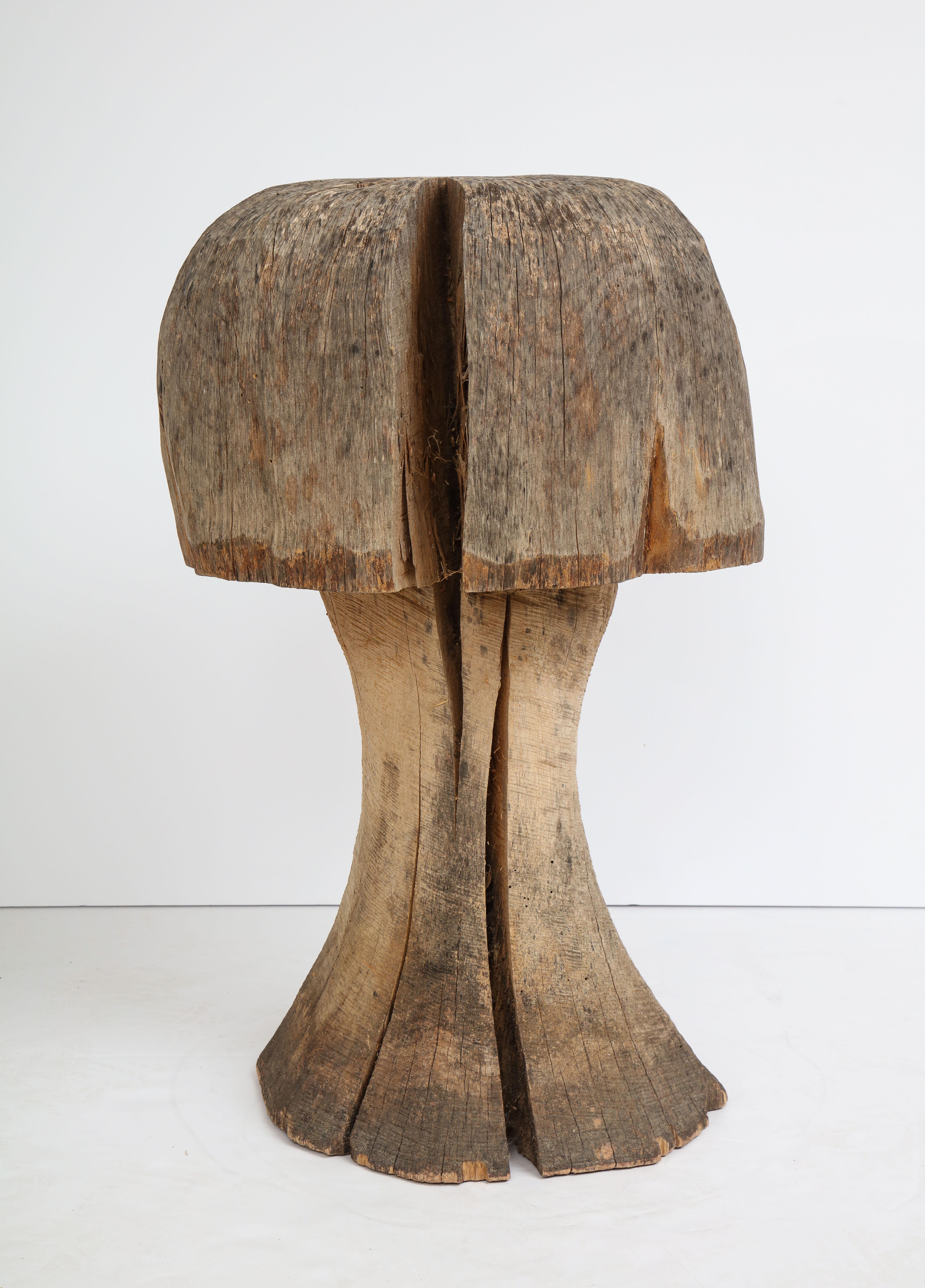 Oak mushroom carved from solid piece of wood.