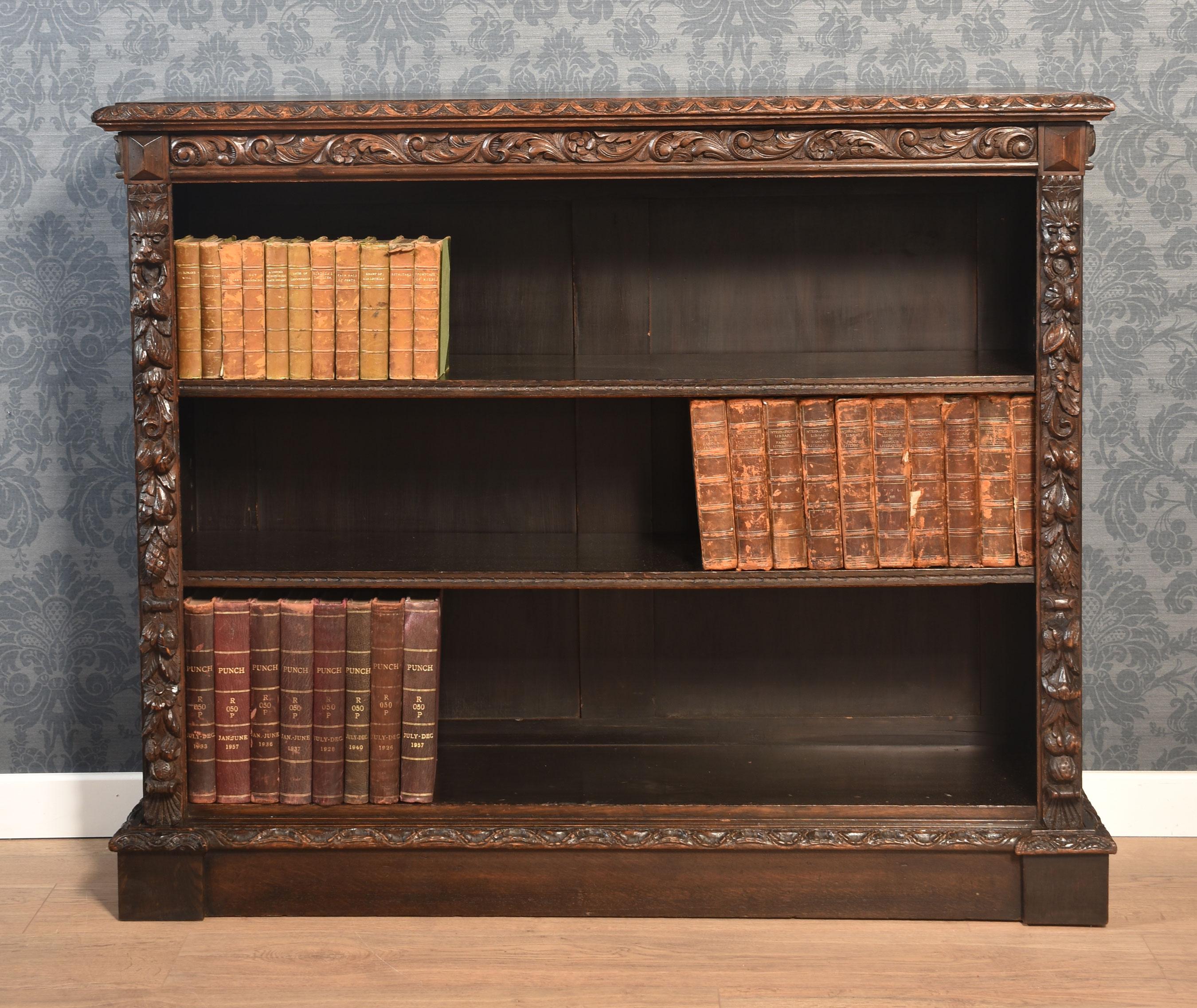 Heavily carved open bookcase the large rectangular top with carved moulded edge. Above adjustable shelves are flanked by carved columns. All raised up on a plinth base.
Dimensions
Height 45 Inches
Width 55 Inches
Depth 15 Inches