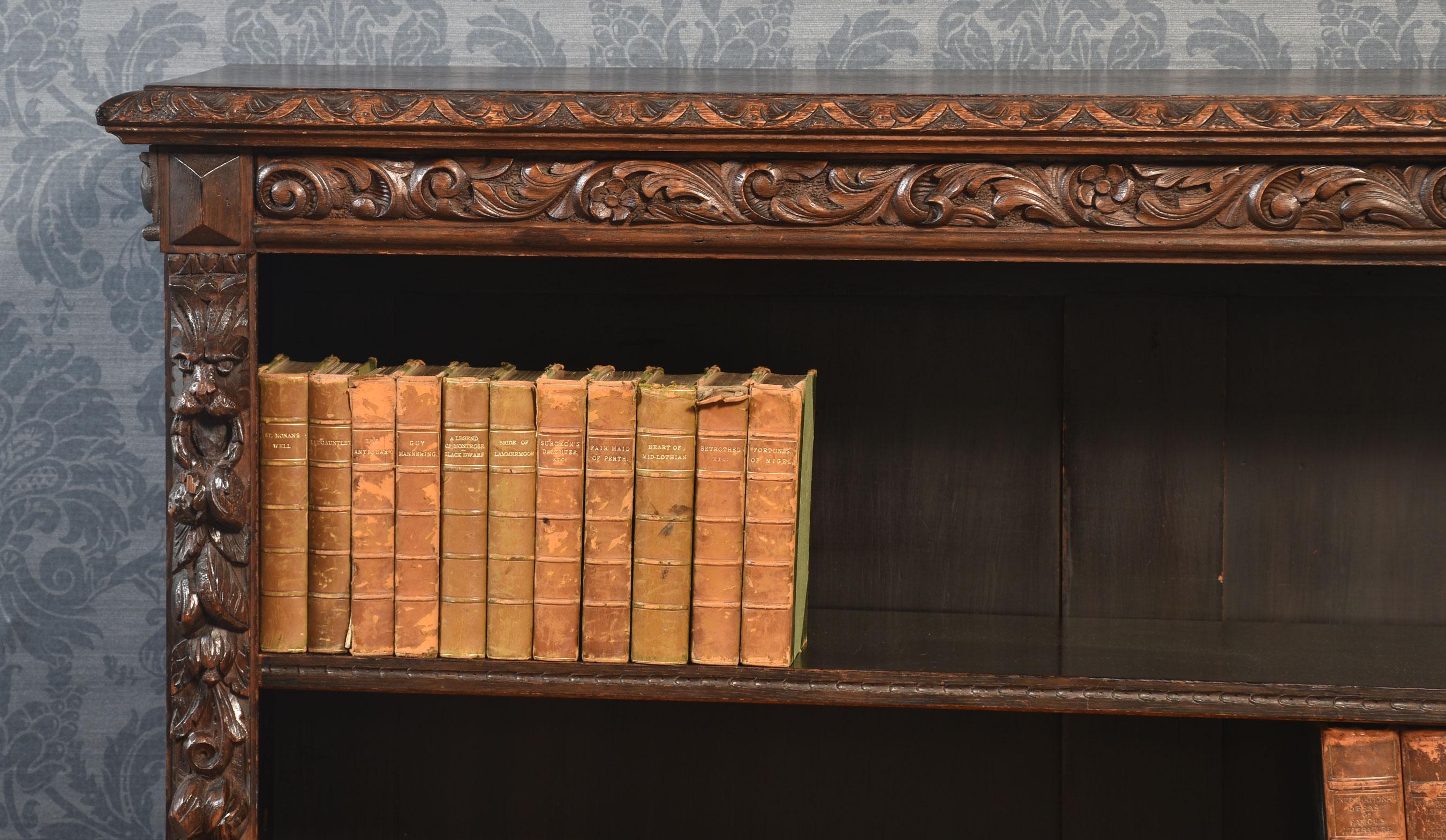British Carved oak open bookcase For Sale